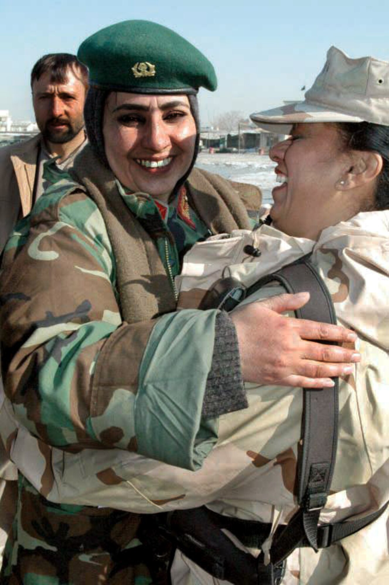 Gen. Myhammadzai Khatul hugs Senior Master Sgt. Elizabeth Melahn in Afghanistan after learning about the sergeant's donation of heating fuel for Afghani civilians. (Courtesy photo)