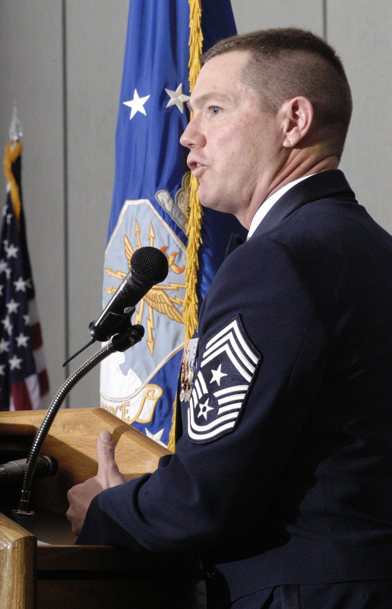 DOVER AIR FORCE BASE, Del. -- Chief Master Sgt. David Popp, Air Combat Command command chief, speaks to Dover’s newest chiefs during Dover’s annual Chief’s Induction Ceremony here March 16. Thirteen chiefs and senior master sergeants were inducted during the ceremony. (U.S. Air Force photo/Senior Airman James Bolinger)