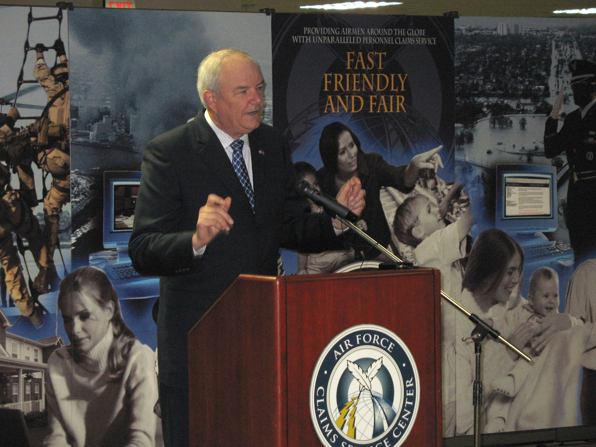 Secretary of the Air Force Michael W. Wynne highlights the benefits new Air Force Claims Service Center March 23 during its opening ceremony in Kettering, Ohio. The center consolidates all Air Force claims centers into one location. Now, Airmen can file claims via the Internet and obtain paralegal assistance 24 hours a day, seven days a week. (U.S. Air Force photo/Tech. Sgt. Steve German) 