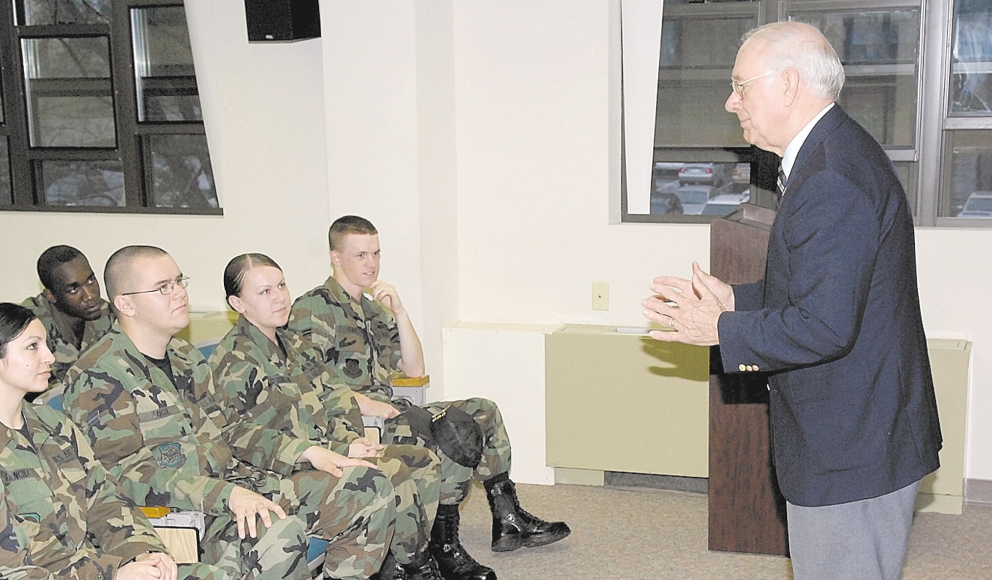 Former Chief Master Sgt. of the Air Force Sam Parish addresses Airmen during a visit to Pope March 15 and 16.