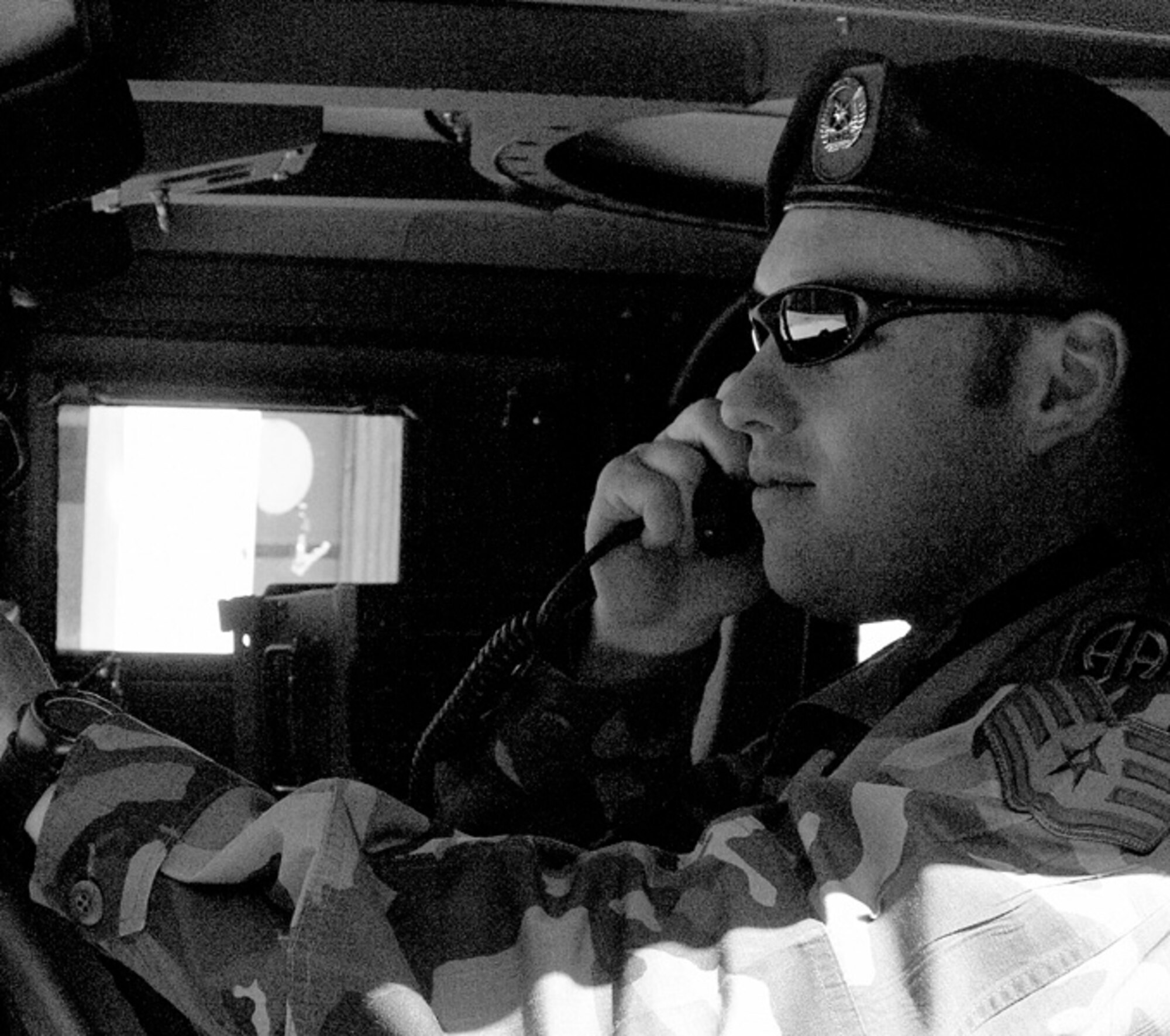 Staff Sgt. Joshua Andrews demonstrates how he conducts tactical air control. He works from a humvee, talking to fighter and bomber aircraft, as well as unmanned aerial vehicles.