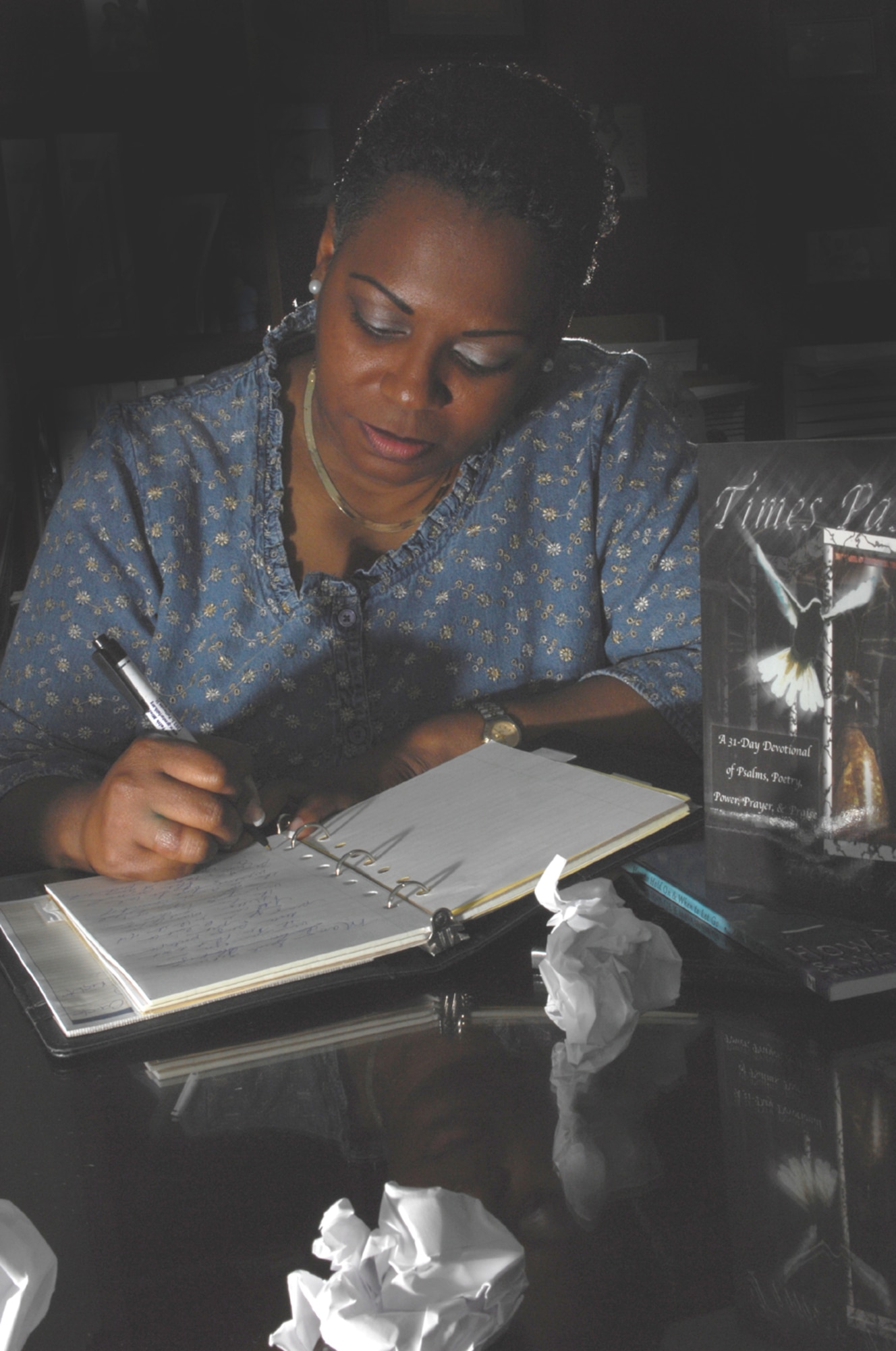 Theresa Allen, 23rd Mission Support Squadron human resources specialist, puts her thoughts down on paper. Thus far, Ms. Allen's "thoughts" have worked their way into three published books. (U.S. Air Force photo by Senior Airman Angelita Lawrence)