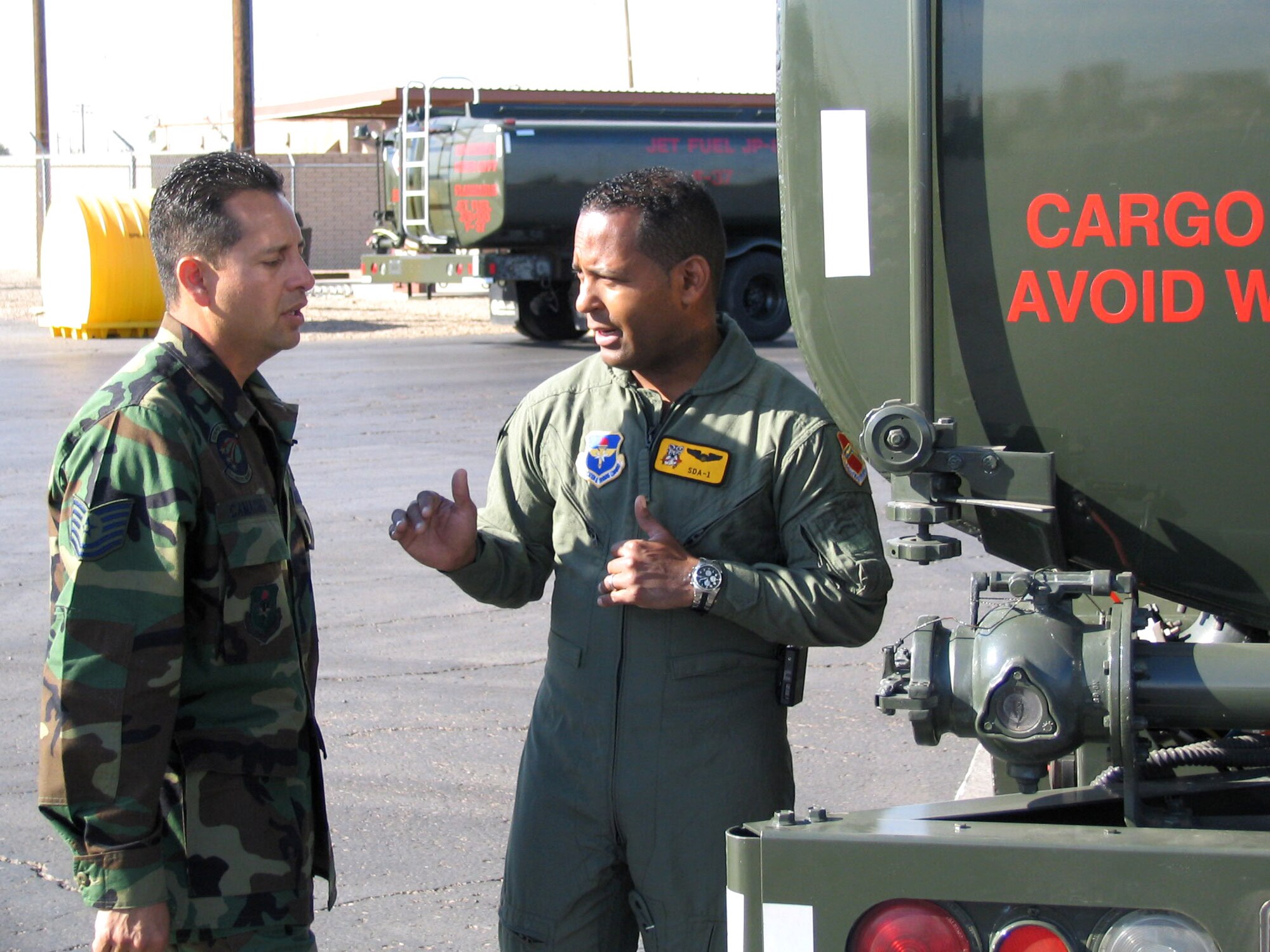 Tony Dandrades (right) interviews Tech. Sgt. Jose Camacho March 21 during his visit to Luke Air Force Base, Ariz., as part of Air Force Week. Mr. Dandrades, who served as an honorary commander for the day, is a Univision reporter for the nationally televised "Primer Impacto." (U.S. Air Force photo/Tech. Sgt. Billy Ray Hartzell II)