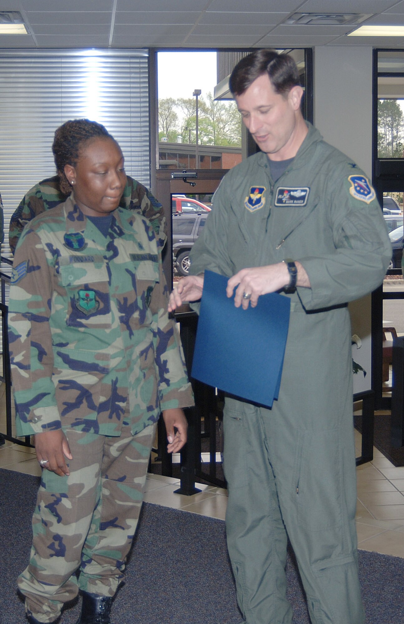 Tech. Sgt. Kimona Woodard, 14th Medical Support Squadron, was surprised by Col. Mark Baker, 14th Flying Training Wing Vice Commander, with a Stripes to Exceptional Performers promotion Monday at the 14th Medical Group clinic. She was promoted in front of the entire 14th Medical Group during what she believed was a brief on an upcoming exercise. 
