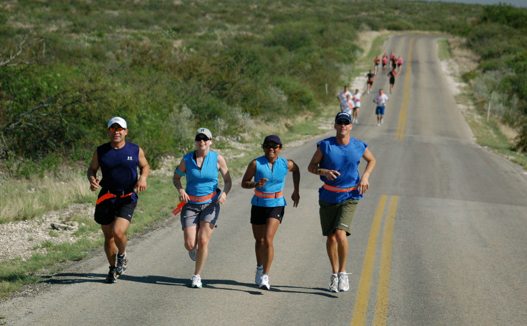 LAUGHLIN AIR FORCE BASE, Texas -- Teams run down the road leading away from Southwinds Marina on Lake Amistad, beginning the running leg of the 2006 Laughlin Adventure Race.  (U.S. Air Force photo by Staff Sgt. Austin M. May)