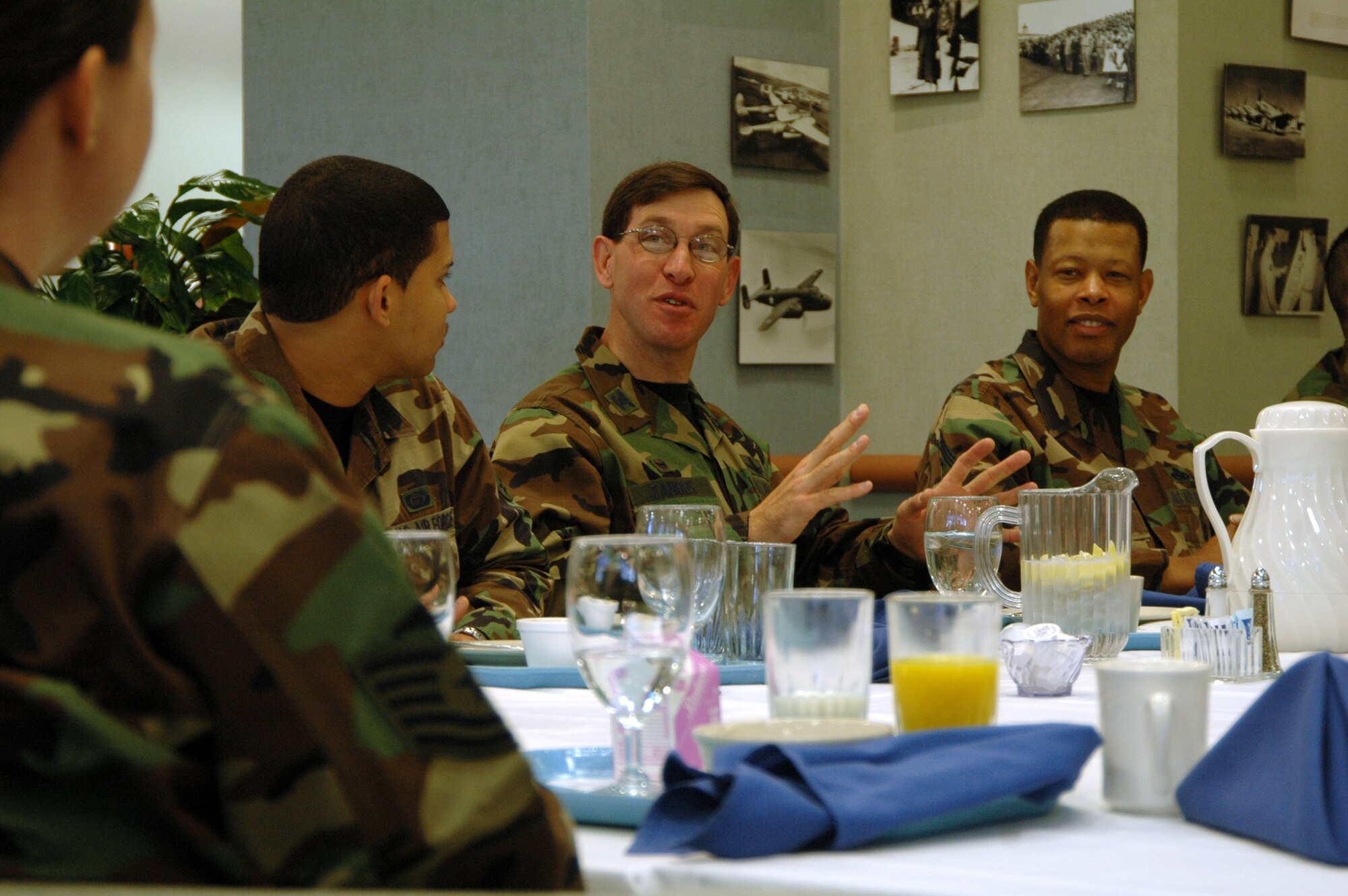 Col. Stephen Tanous, 30th Space Wing commander, and Command Chief Timothy Gordon, 30th Space Wing command chief, chat with 20 Airmen who were chosen to eat breakfast with the new wing commander at Breakers Dining Facility, March 22.  The breakfast gave wing leadership the chance to answer Airmen’s questions such as those that pertain to cost of living allowance, base gas prices and eligibility to move off base for junior enlisted.  In December 2006, a question raised during the breakfast affected the entire Department of Defense, when a Vandenberg Airmen brought her concern about the Child Development Center to wing leadership.  Since then, CDC’s no longer include combat duty pay when calculating the cost for child care. (U.S. Air Force photo by Senior Airman Stephen Cadette)