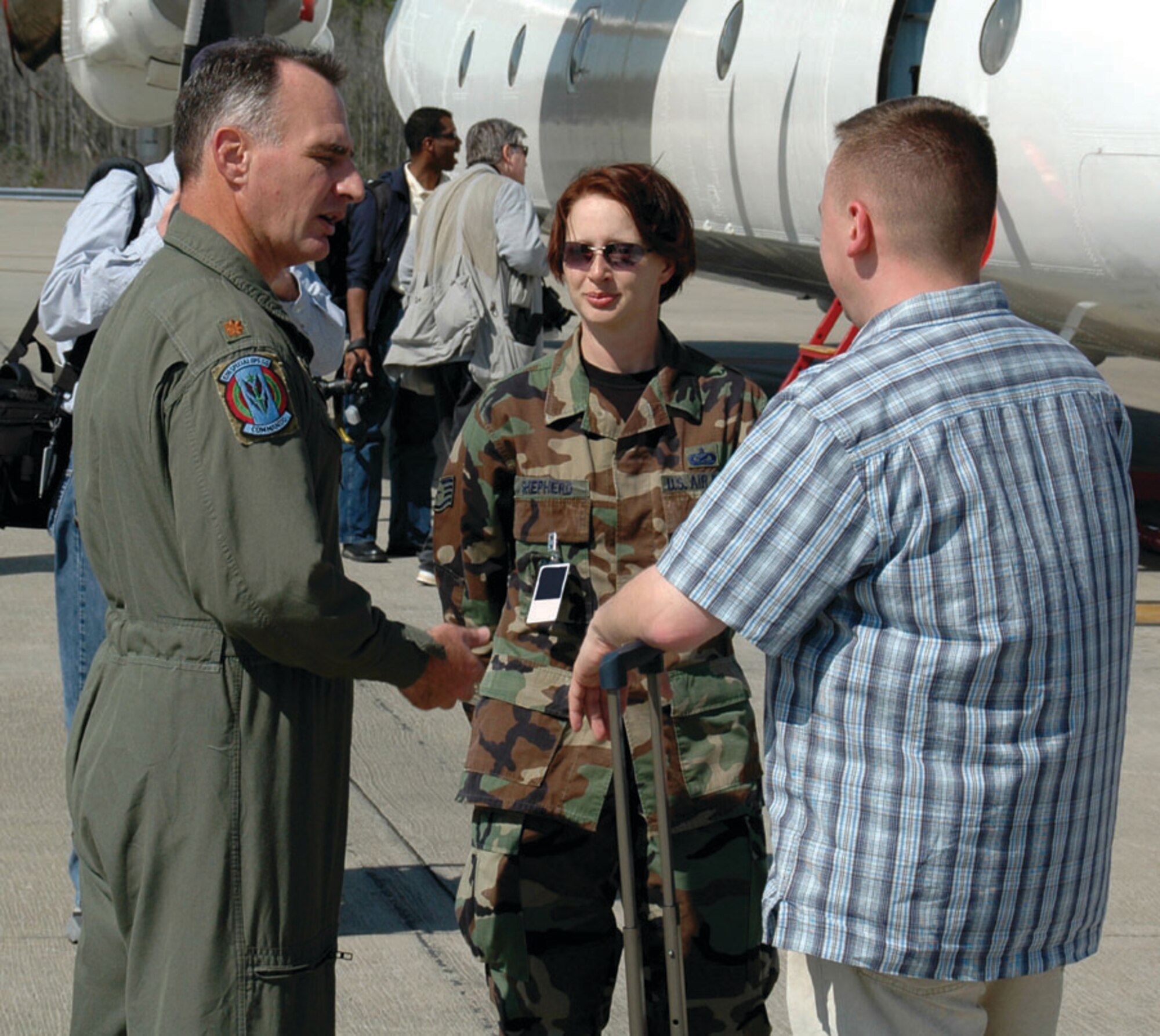 A foreign internal defense advisor (left) from the 6th Special Operations Squadron talks with a member of the media March 16, while Staff Sgt. Angela Shepherd, 1st Special Operations Wing public affairs, facilitates the interview. Public affairs action teams provide a multitude of support to Team Hurlburt. (U.S. Air Force photo by Capt. Joseph Coslett)