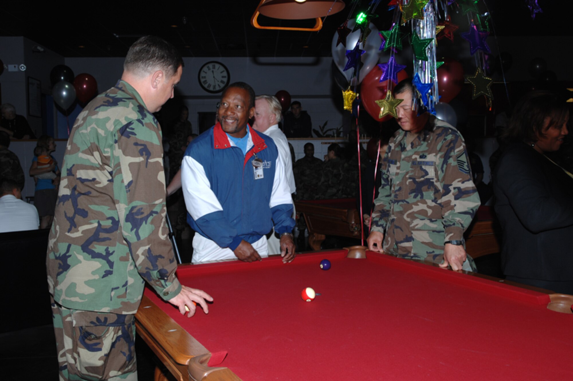Guests talk and celebrate during the grand opening of The Landing Zone March 15. (U.S. Air Force photo by Senior Airman Cynthia Morrow)