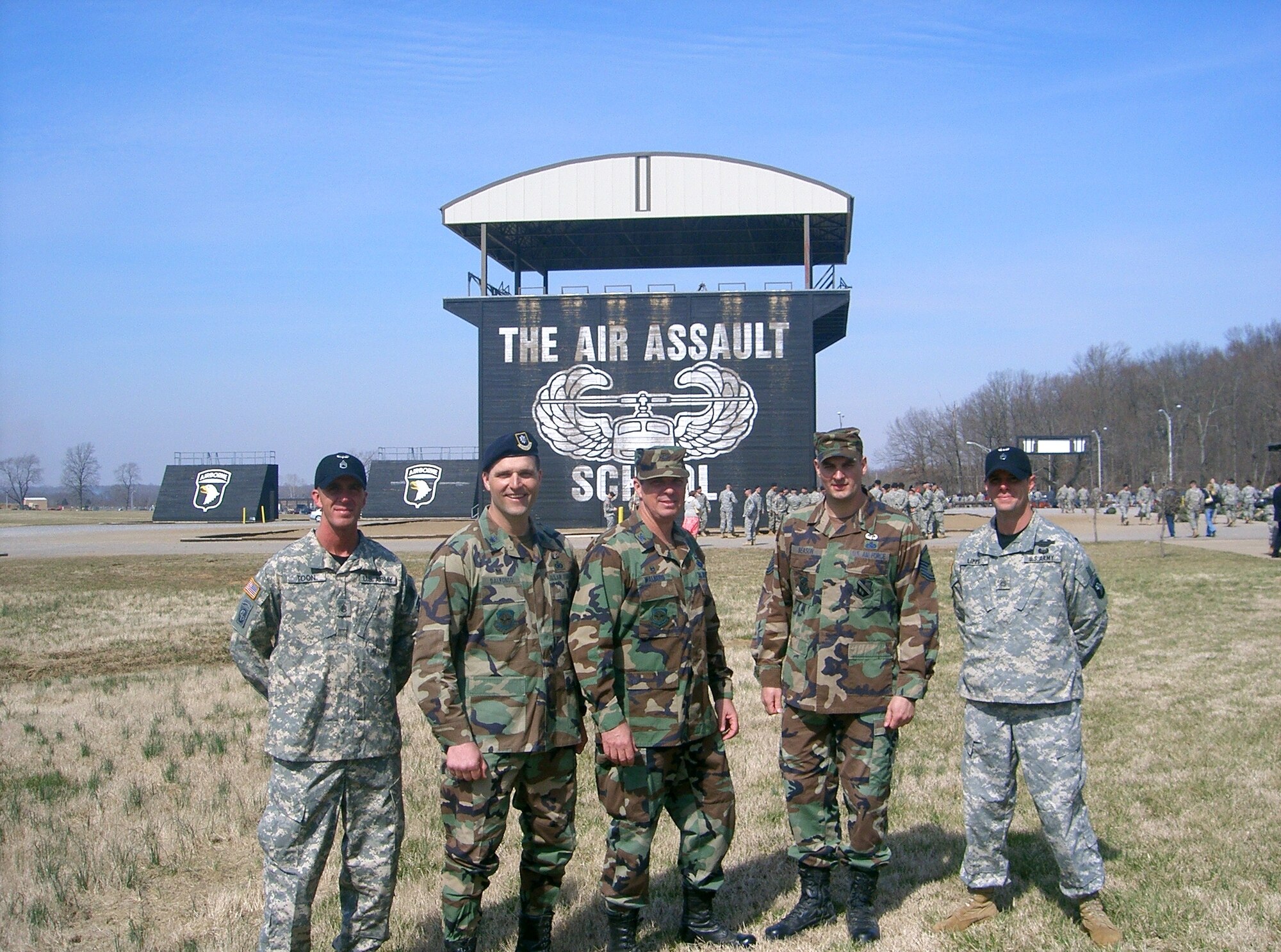 Left to right, Lt. Col. Kenneth D’Alfonso, 818th GMRS commander, Col. Richard Walberg, 818th CRG commander and Master Sgt. Bubba Beason, 818th CRG first sergeant, with their Army Air Assault School instructors on graduation day at Fort Campbell, Ky.