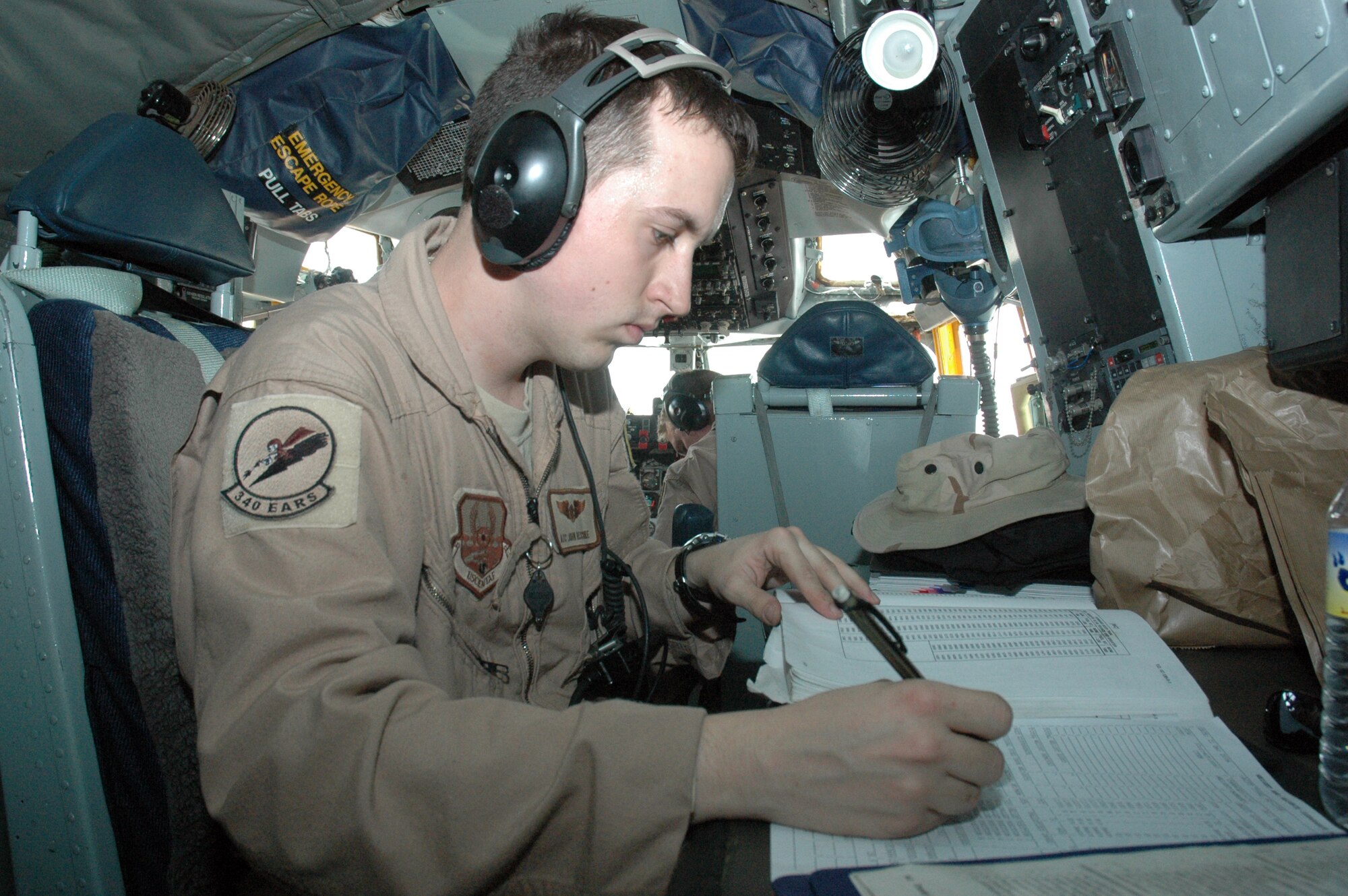 Airman 1st Class John Reschke, 340th Air Refueling Squadron boom operator, calculates the weight and balance of the KC-135 Stratotanker before takeoff from the 379th Air Expeditionary Wing. The 340th EARS transfers significant amounts of fuel to a variety of Coalition aircraft throughout the entire AOR, with an aircraft that is oftentimes double the age in years of the Airmen who fly and maintain it. (U.S. Air Force photo by Senior Airman Erik Hofmeyer)
