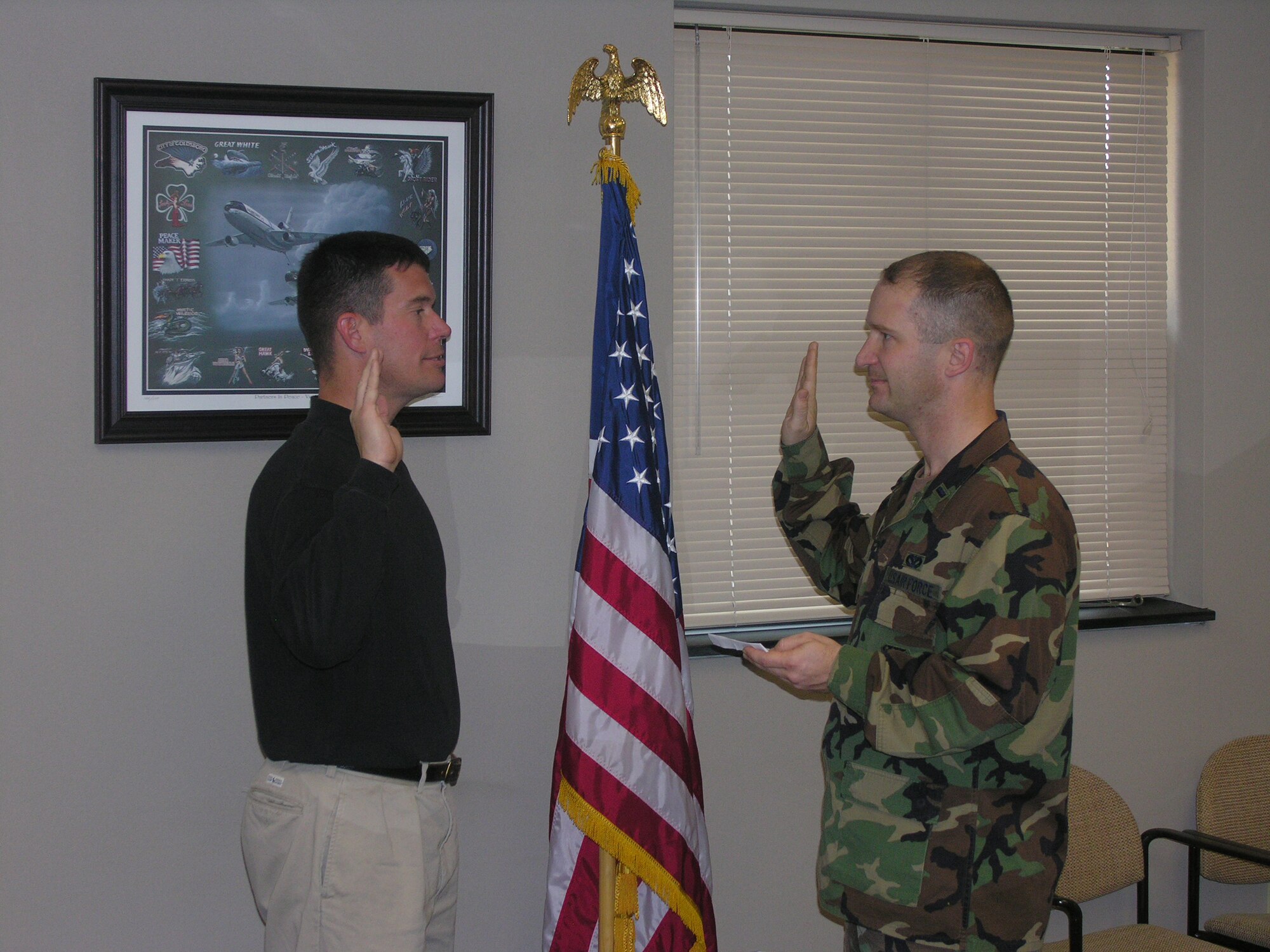 Tech. Sgt. Stephen Woofter, a member of the 514th Air Mobility Wing at McGuire Air Force Base, N.J. re-enlists in the U.S. Air Force during a ceremony performed by his brother, 1st Lt. Christopher Woofter, 916th Air Refueling Wing, Air Force Reserve.

Sergeant Woofter previously served in the Virginia Army National Guard as an infantry instructor.

"I was ecstatic to be able to perform the ceremony for my brother," said Lt. Woofter.

Lt. Woofter explained on a sibling rivalry note that it is his signature that resides at the bottom of his brother's enlistment documents for the next six years.

"I am so happy that our family continues to have strong ties to the military and that many of our family members were able to attend the ceremony," said Lt. Woofter.