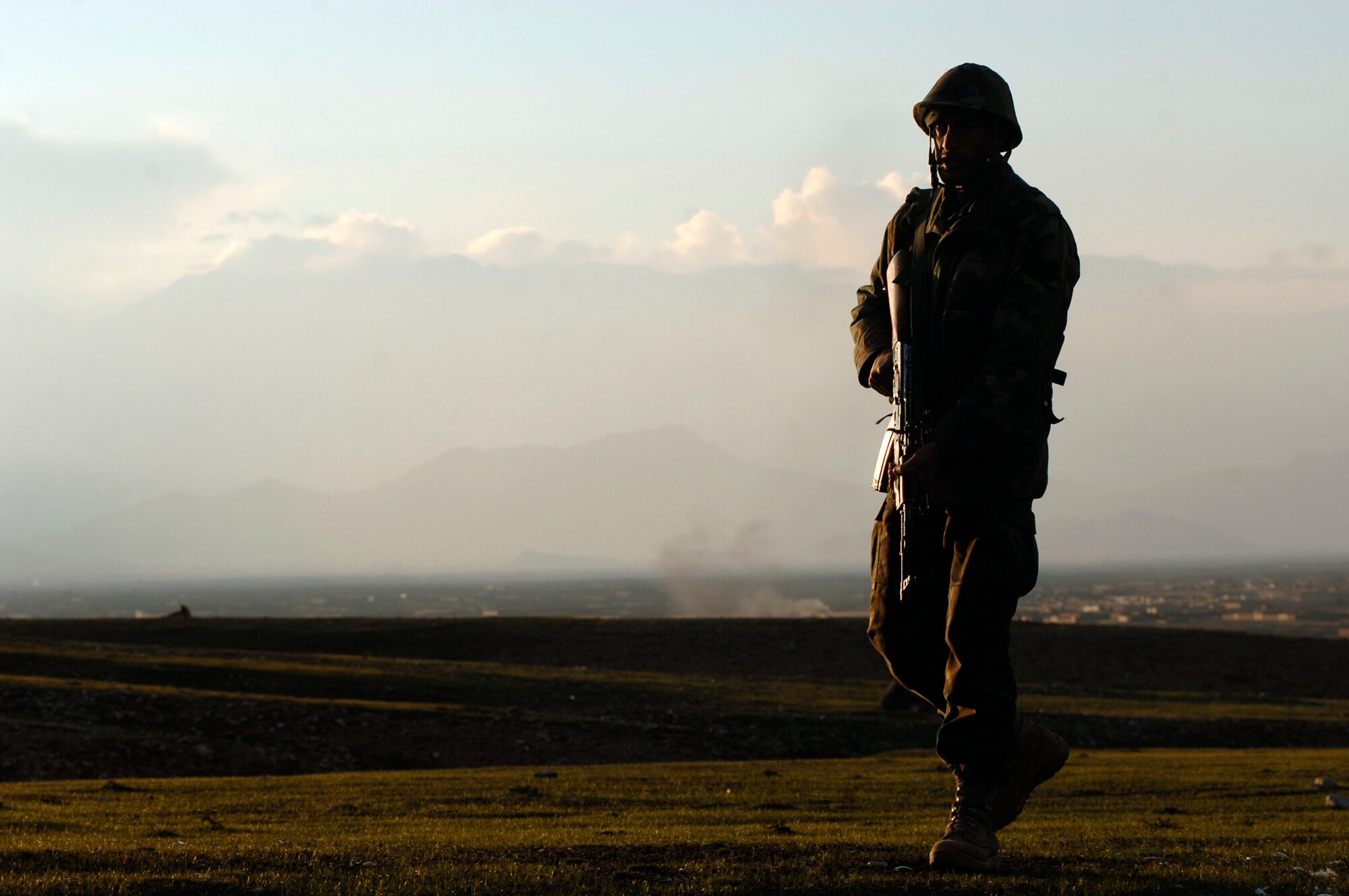 An Afghan National Army trainee provides perimeter security during training at the Kabul Military Training Center, or KMTC.   Approximately 19 U.S. Air Force members provide guidance and mentorship for the instructors, officers and trainees at KMTC.  The ISAF and U.S. military  provide the maximum amount of guidance for the Afghan National Army to independently sustain the security of its own country.  (U.S. Air Force photo/Tech. Sgt. Cecilio M. Ricardo Jr.) 