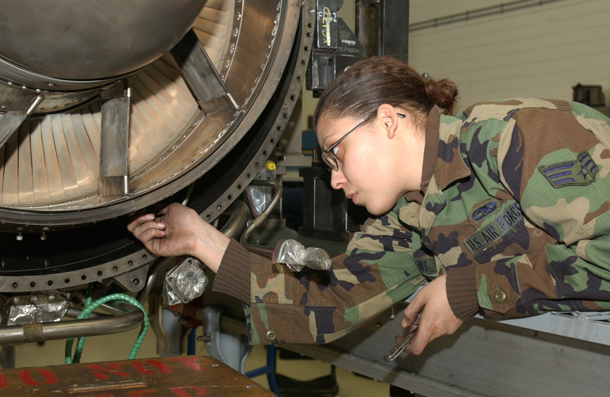 SPANGDAHLEM AIR BASE, GERMANY --  Senior Airman Jacquelynn Mathews, 52nd Component Maintenance Squadron propulsion journeyman, installs a low pressure turbine on engine 9574 for an F-16 here Tuesday. She’s helping to prep the engine for movement as a result of the Lean team’s redesigned/improved layout of the jet engine shop. The Lean Event, which began Monday, a week-long event, is a re-look (first one in the wing) at the engine production process which will build on and validate improvements made during the shop’s original Lean event which took place here in February 2006. (US Air Force photo/Airman 1st Class Emily Moore)
