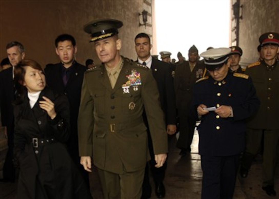 Chairman of the Joint Chiefs of Staff U.S. Marine Gen. Peter Pace is given a guided tour of the Forbidden City in Beijing, China, March 23, 2007.