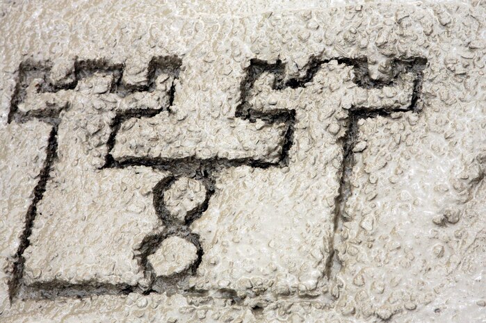 AL TAQADDUM, Iraq (March 26, 2007) ? The Marines of Engineer Support Company, 8th Engineer Support Battalion, 2nd Marine Logistics Group (Forward), call it a day and leave their mark on recently laid concrete here March 26.  The Marines went on a route repair mission in which they filled craters to safeguard coalition and Iraqi forces.
