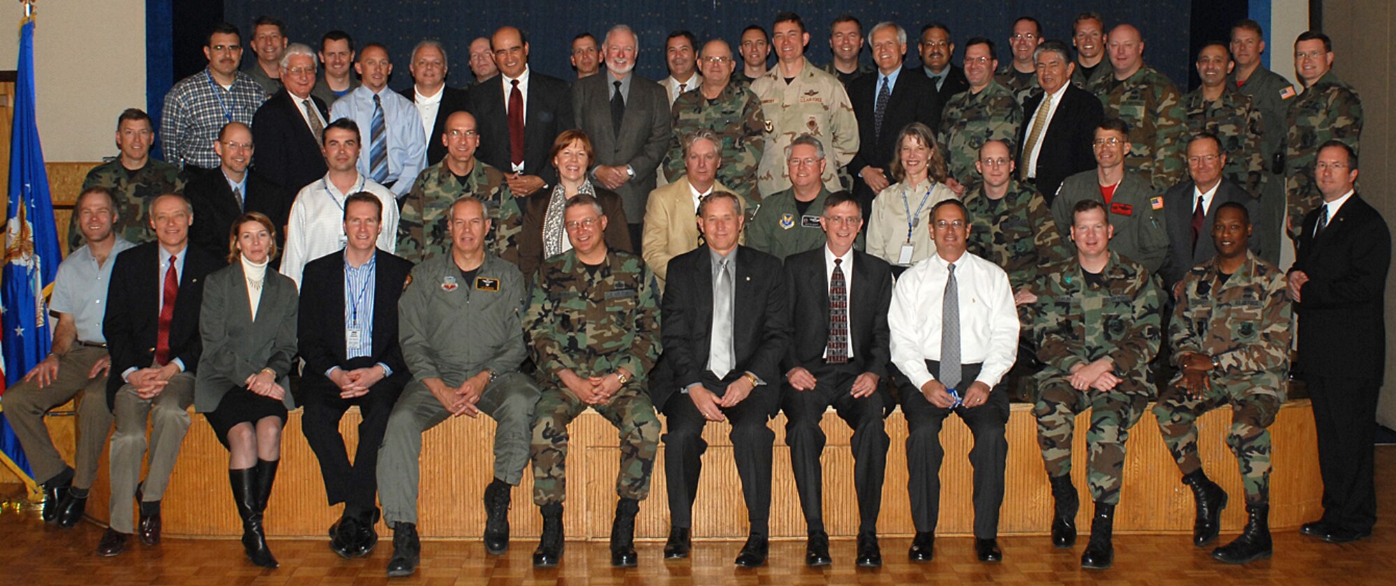 The honorary commanders for the base sit on the stage at the Mountain View Club March 16. The Honorary Commanders Program began in 1995 to help build and maintain a strong relationship between the base and surrounding community.  (U.S. Air Force photo by Todd Berenger)