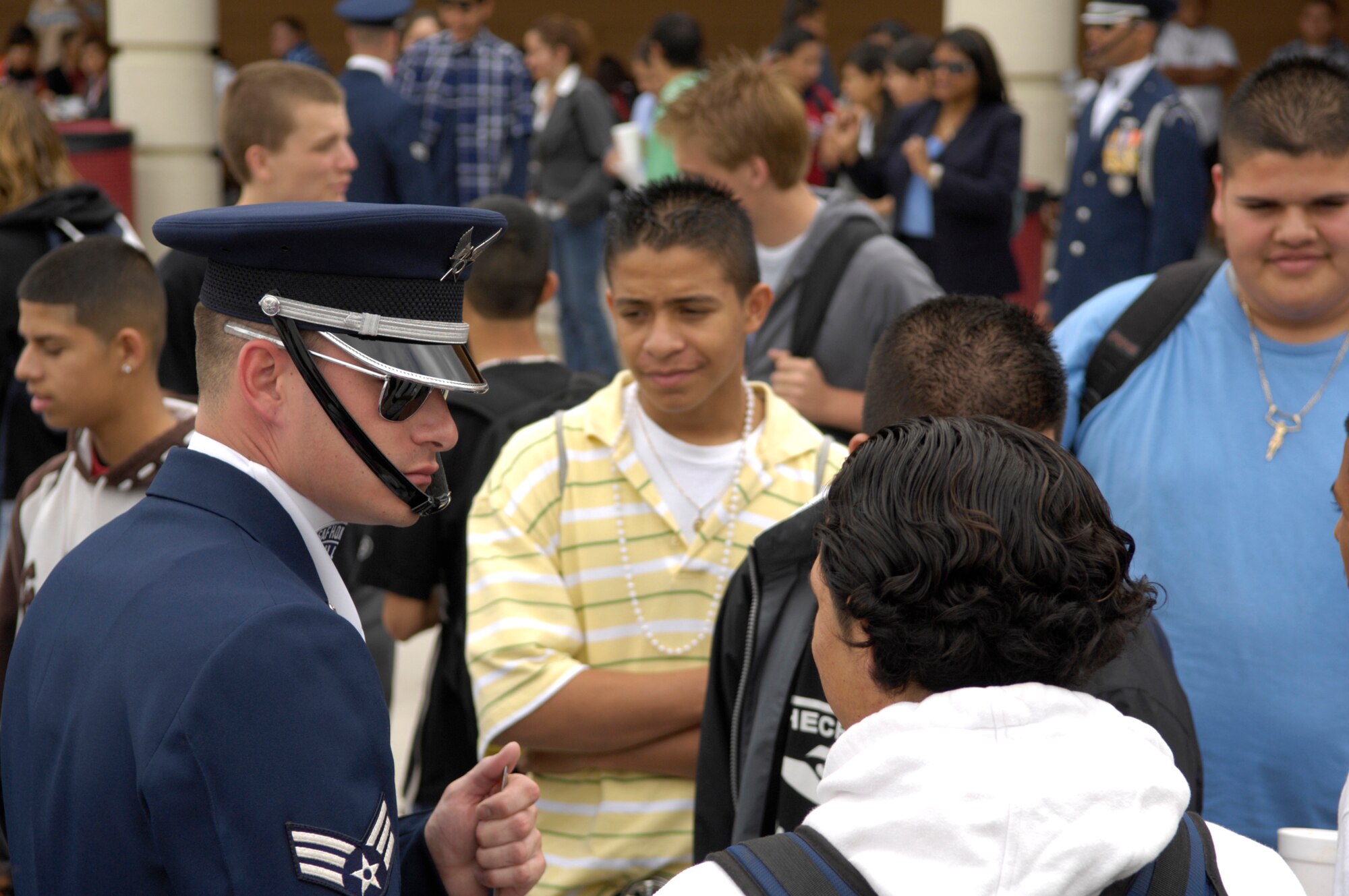 Senior Airman Adam Clonick and the United States Air Force Honor Guard Drill Team speak with students after the teams performance at Dysart High School, El Mirage, Ariz., March 23, 2007.  The team performed as a community relations event before their performance at the Luke Air Force Base Air Show. The Drill Team is the traveling component of the Air Force Honor Guard and tours Air Force bases world wide showcasing the precision of today's Air Force to recruit, retain, and inspire Airmen for the Air Force mission. (U.S. Air Force photo by Airman 1st Class Rusti Caraker)(Released)