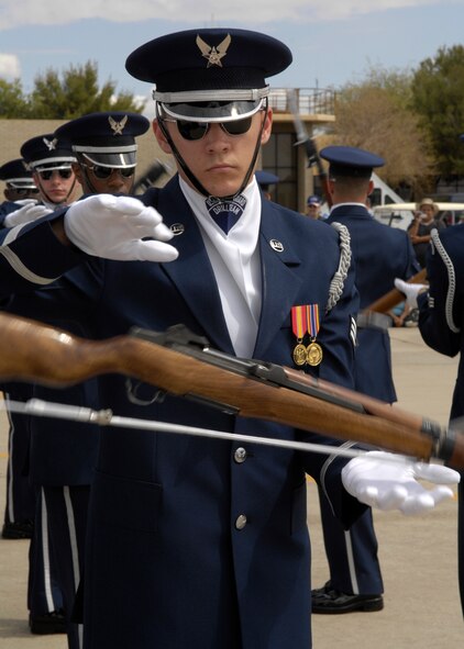 Senior Airman Jason Martin of The United States Air Force Honor Guard Drill Team, performs during the air show at Luke Air Force Base, Ariz., March 24, 2007. The Drill Team is the traveling component of the Air Force Honor Guard and tours Air Force bases world wide showcasing the precision of today's Air Force to recruit, retain, and inspire Airmen for the Air Force mission. (U.S. Air Force photo by Airman 1st Class Rusti Caraker)(Released)