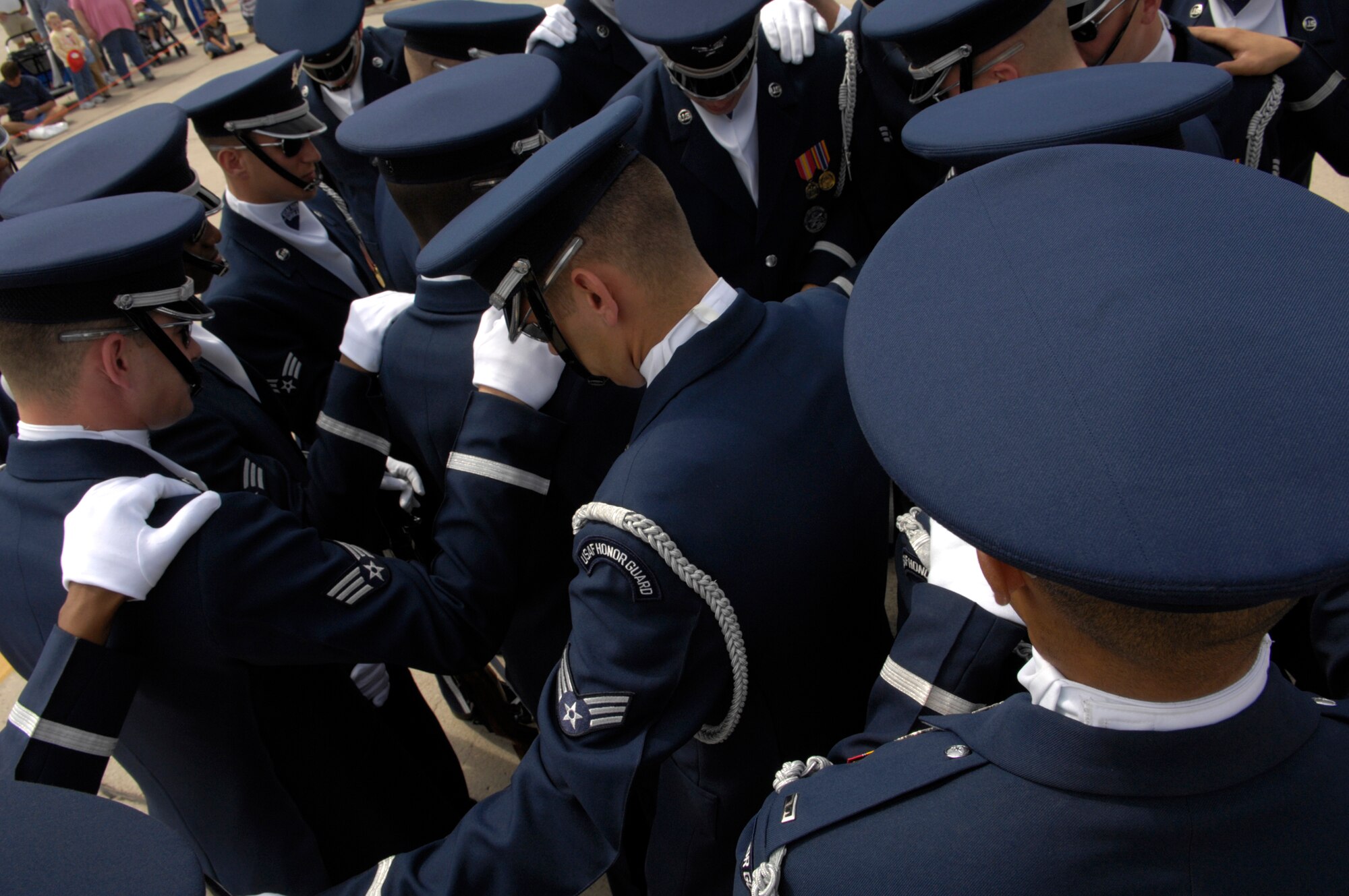 The United States Air Force Honor Guard Drill Team prepares together before their performance at the air show on Luke Air Force Base, Ariz., March 24, 2007. The Drill Team is the traveling component of the Air Force Honor Guard and tours Air Force bases world wide showcasing the precision of today's Air Force to recruit, retain, and inspire Airmen for the Air Force mission. (U.S. Air Force photo by Airman 1st Class Rusti Caraker)(Released)