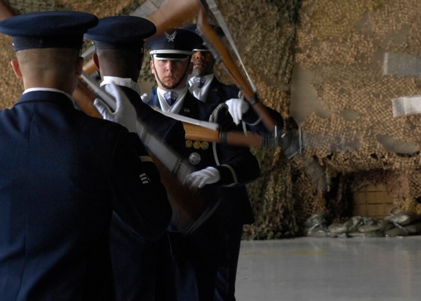 Senior Airman David Leininger of the United States Air Force Honor Guard Drill Team, performs during the air show at Luke Air Force Base, Ariz., March 24, 2007. The Drill Team is the traveling component of the Air Force Honor Guard and tours Air Force bases world wide showcasing the precision of today's Air Force to recruit, retain, and inspire Airmen for the Air Force mission. (U.S. Air Force photo by Airman 1st Class Rusti Caraker)(Released)