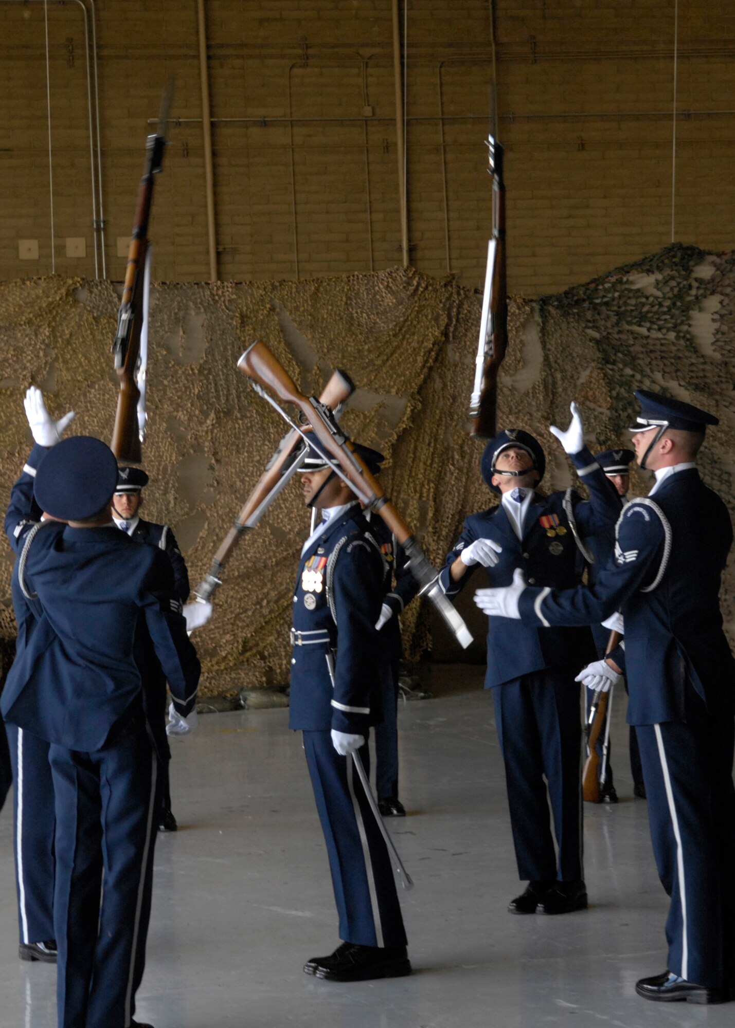 The United States Air Force Honor Guard Drill Team performs during the Luke Air Force Base Air Show in Arizona on March 24, 2007. The Drill Team is the traveling component of the Air Force Honor Guard and tours Air Force bases world wide showcasing the precision of today's Air Force to recruit, retain, and inspire Airmen for the Air Force mission. (U.S. Air Force photo by Airman 1st Class Rusti Caraker)(Released)
