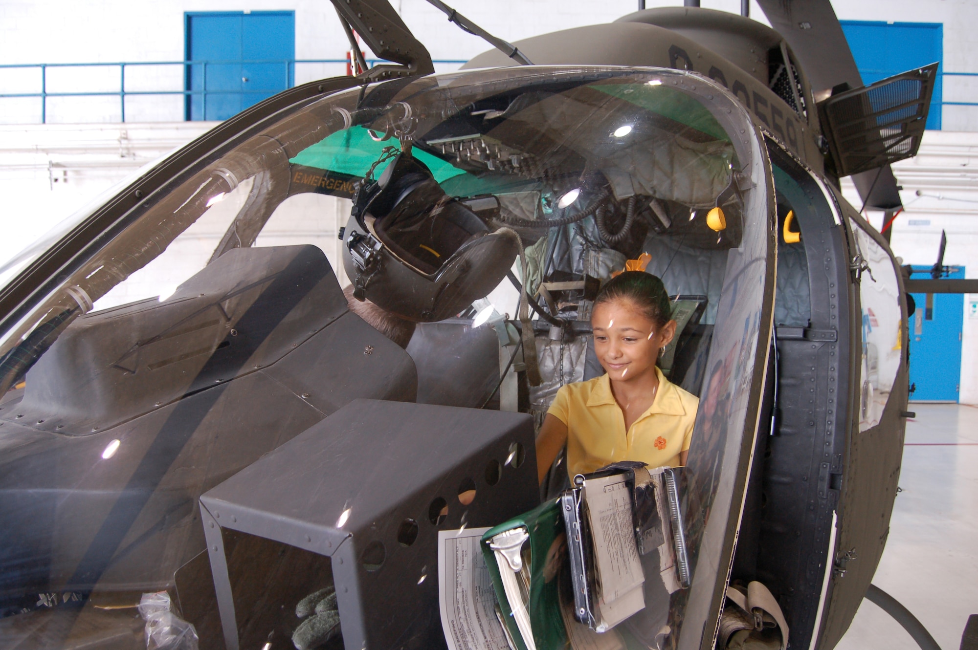 A child sits in a customs and border patrol OH-58 helicopter during a March 22 open house at Coast Guard Air Station Borinquen, Puerto Rico. Coast Guard Air Station Borinquen is located at what used to be Ramey Air Force Base, which closed in 1973. Approximately 500 visitors got a firsthand look at today?s military members and equipment in Puerto Rico, and to see an historic C-54 cargo plane used during the Berlin Airlift. (U.S. Air Force photo/Tech. Sgt. Ben Gonzales)