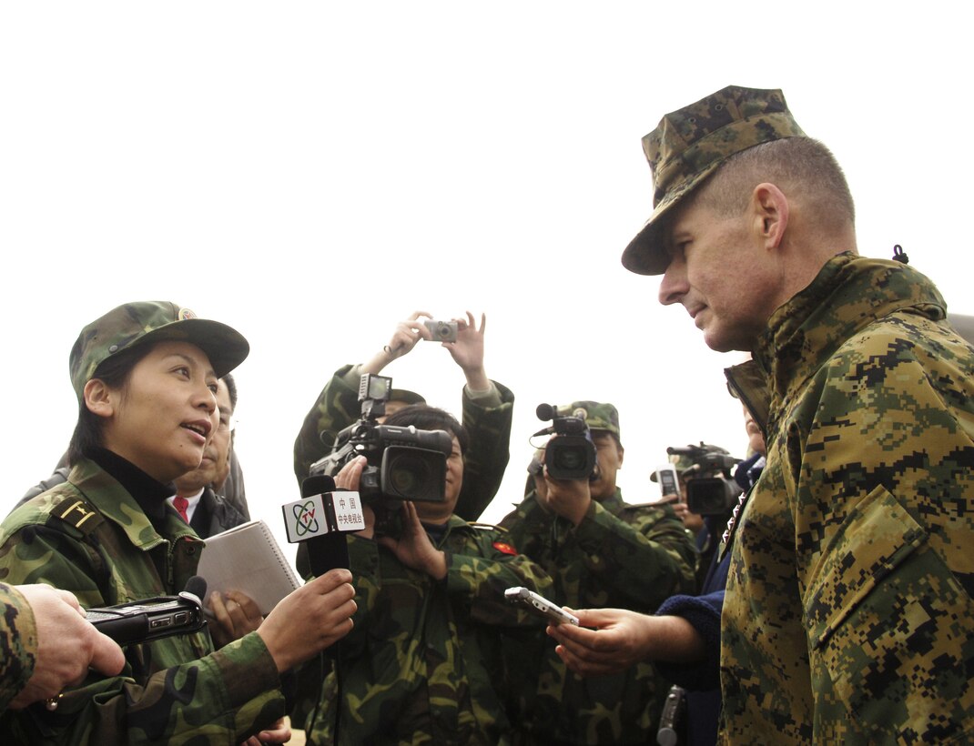 Chairman of the Joint Chiefs of Staff U.S. Marine Gen. Peter Pace gives a televised interview with a People's Liberation Army correspondent at Shenyang training base, China, March 24, 2007. 