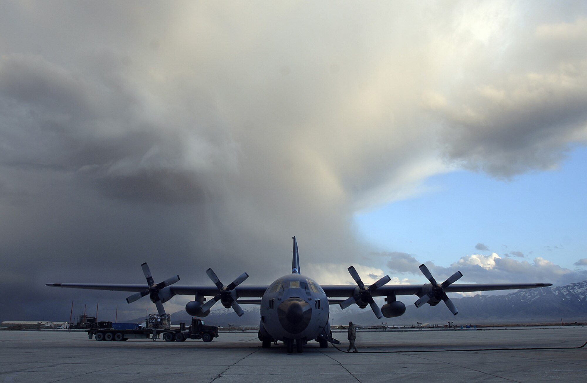 A C-130 Hercules taxis in to refuel at the Bagram Airfield, Afghanistan March 22. This week Air Force C-130s and C-17 GLobemaster IIIs flew nearly 1,131 airlift sorties, delivered more than 2,681 tons of cargo, and transported approximately 22,103 passengers. (U.S. Air Force photo/Tech. Sgt. Cecilio M.Ricardo)