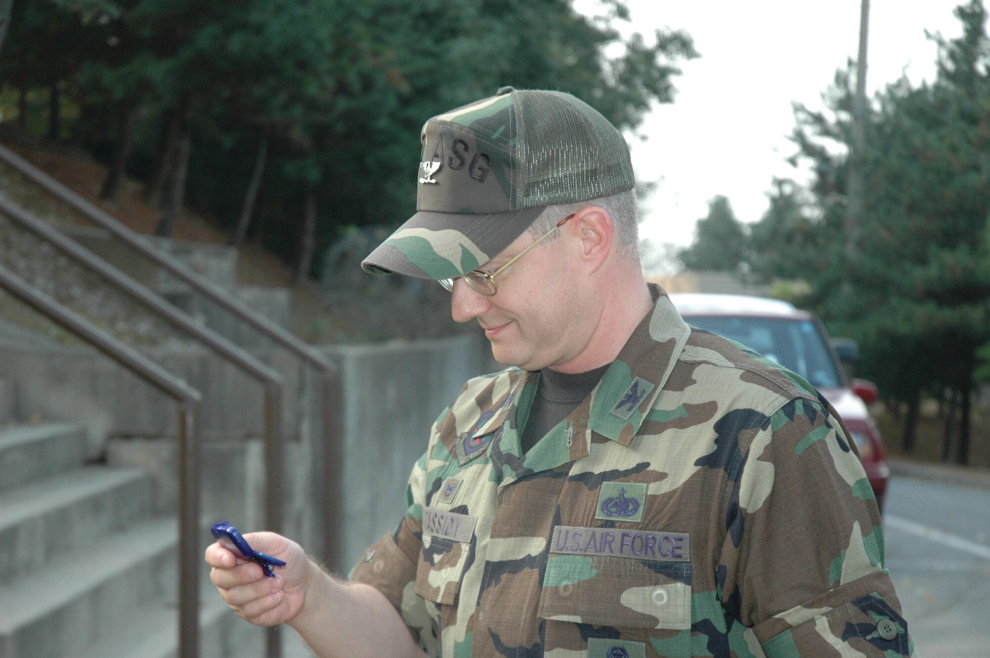 OSAN AIR BASE, Republic of Korea --  Col. Sean Cassidy, 607th Air Support Group commander, checks his pedometer to see how many steps he’s taken Oct. 20. (U.S. Air Force photo by 2nd Lt. Kim Schaerdel)