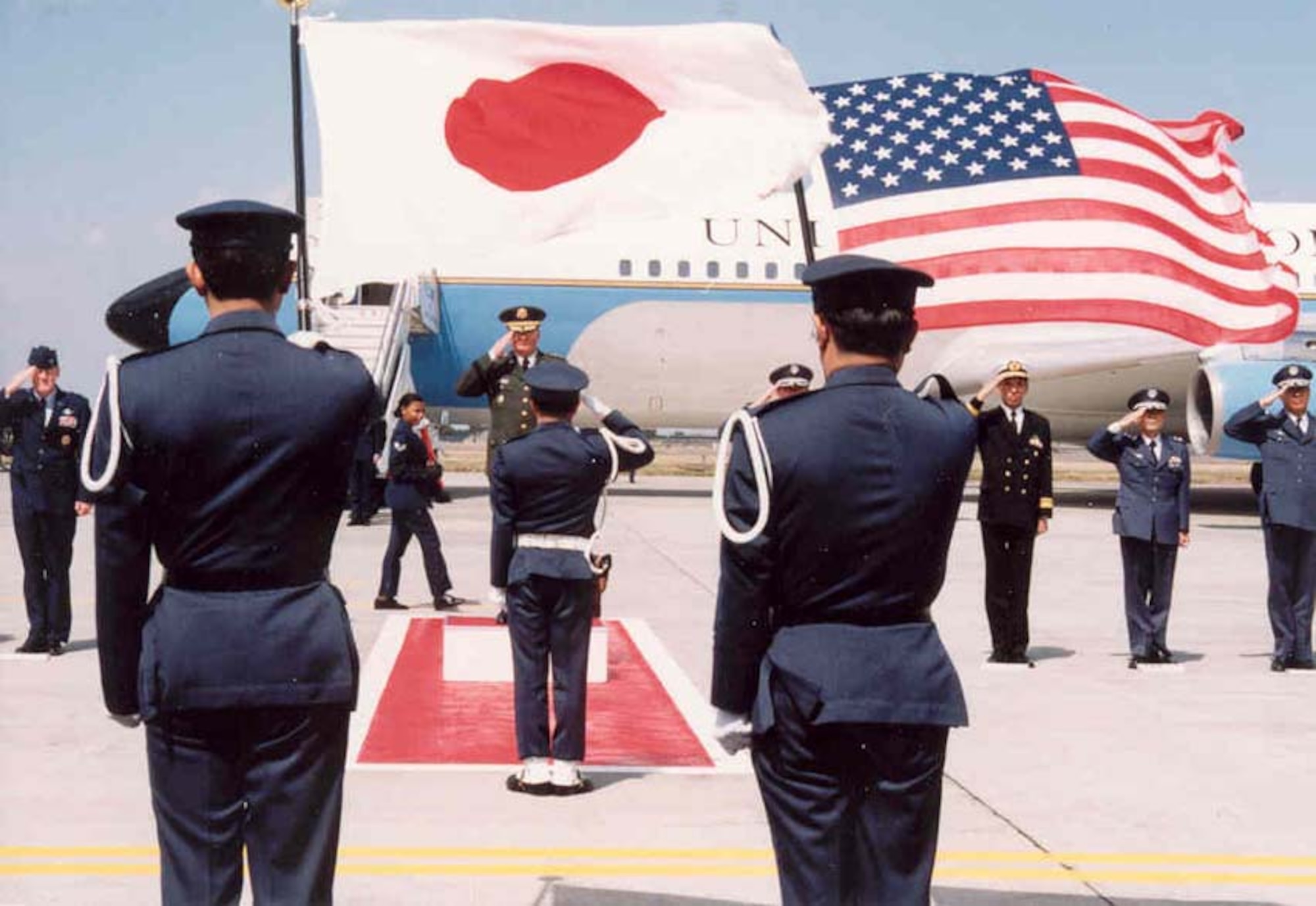 970411-- MISAWA AIR BASE, Japan -- Gen. John Shalikashvili, chairman of the Joint Chiefs of Staff, arrives at Misawa April 11, 1997, where he was met by Col. Bruce Wright, 35th Fighter Wing commander, Japan Air Self-Defense Force leadership and  honor guard detail. (Courtesy photo)