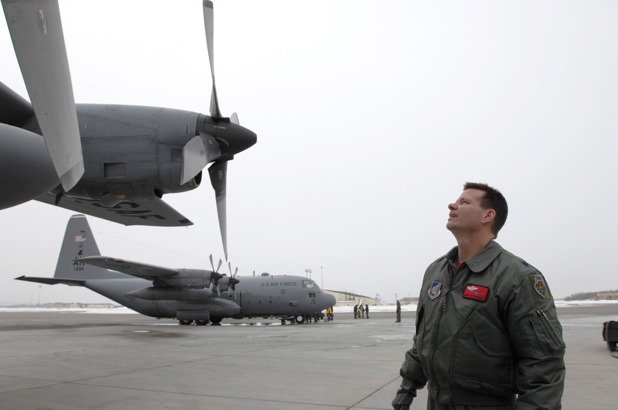 ELMENDORF AIR FORCE BASE, Alaska -- Lt. Col. Gary Gottschall, C-130 pilot and 517th Airlift Squadron commander, inspects a C-130 Hercules before its final flight with the  517th AS. The final C-130 flight March 23 marked the end of the squadron’s C-130 mission here after 43 years of service. The 517th AS is converting C-17s and the C-130s have relocated to Yokota Air Base, Japan, and Dyess Air Force Base, Texas. (U.S. Air Force photo by Tech. Sgt. Keith Brown)