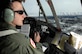OVER ALASKA -- Capt. Ryan Hendrickson looks out over the vast Alaska wilderness during the final C-130 flight for the 517th Airlift Squadron March 23. After 43 years of continuous service in Alaska, the flight marked the end of the C-130 era at the 517th AS and will see the C-17 taking over the mission soon. The flight was also significant for other reasons to Captain Hendrickson, who proposed to his girlfriend, Charui, shortly after landing. (U.S. Air Force photo by Tech. Sgt. Keith Brown)