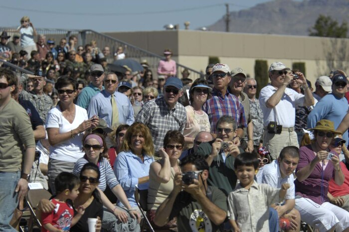 A crowd watches the U.S. Air Force Thunderbirds perform their aerial acrobatics during the kick-off of their 2007 season March 16 during the acceptance show at Nellis Air Force Base, Nev. (U.S. Air Force Staff Sgt. Kenny Kennemer)
