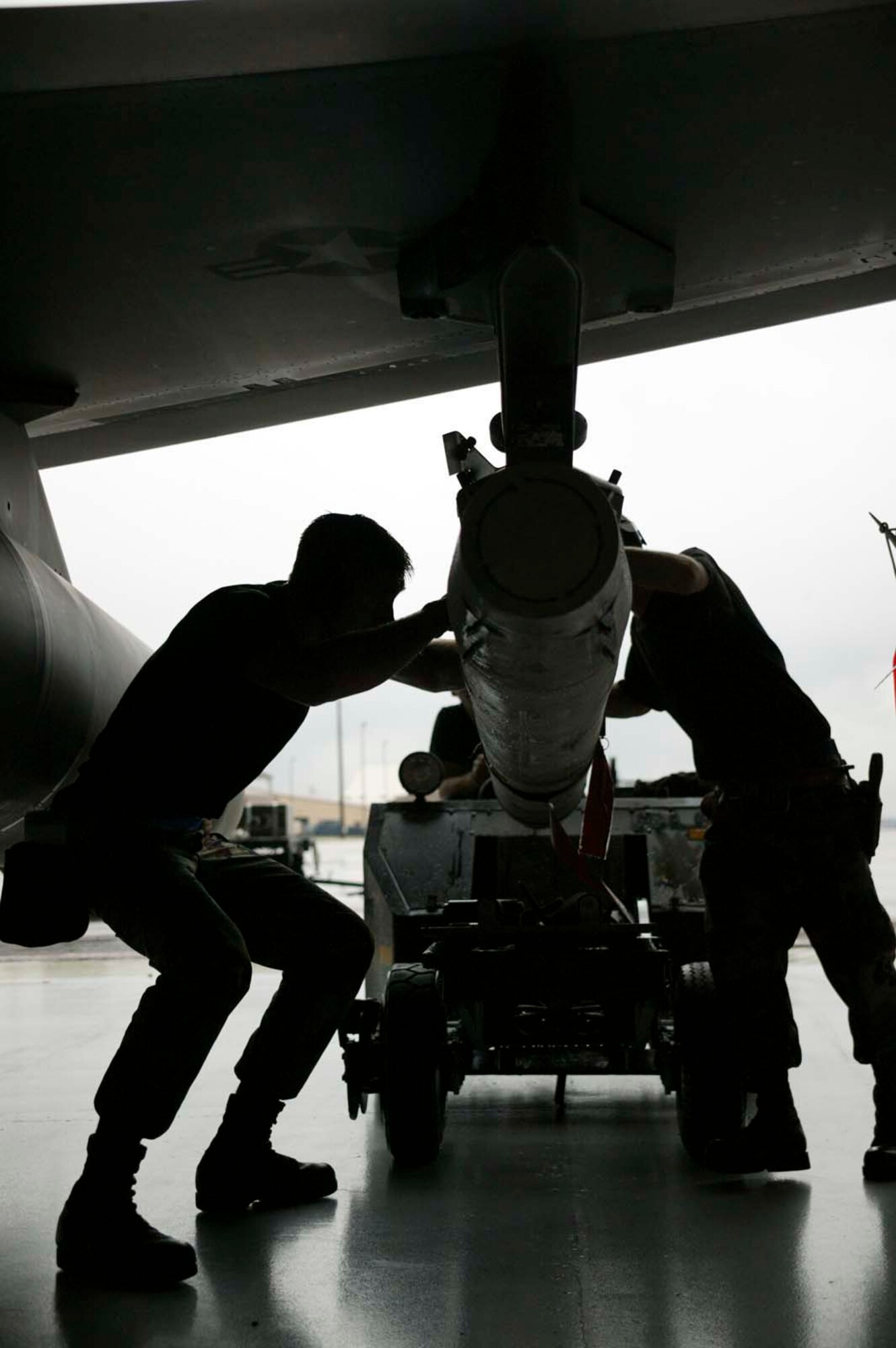 SHAW AIR FORCE BASE, S.C. -- Members of the 55th Aicraft Maintenace Unit load an AGM-88 high-speed anti-radiation missile to an F-16 during the Load Crew of the Year competition March 16. Each of the four crews who competed had previously won a quarterly load crew competition to earn their position in the annual event. The winning crew takes the title and carries the trophy home, to their squadron. (U.S. Air Force photo/Senior Airman Holly MacDonald)