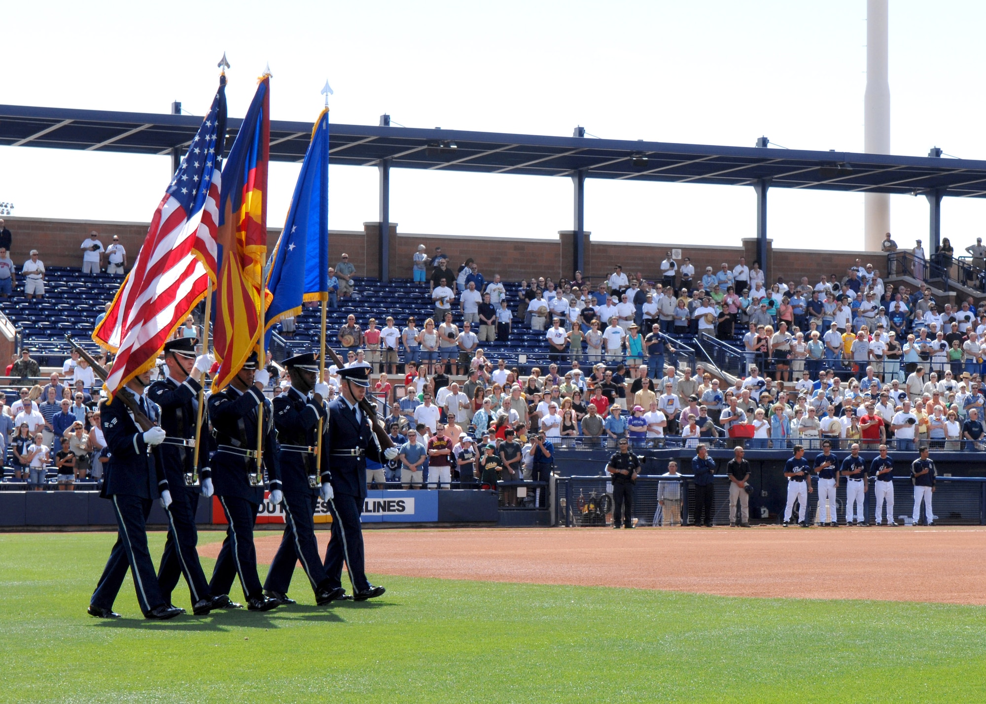 The Luke Air Force Base Honor Guard posts the colors before the start of a 2007 spring training baseball game between the San Diego Padres and the Milwaukee Brewers March 21. The Airmen were in attendance supporting Air Force Week in Arizona, an event that highlights the Air Force and thanks the community for its support. (U.S. Air Force photo/Staff Sgt. Brian Ferguson)
