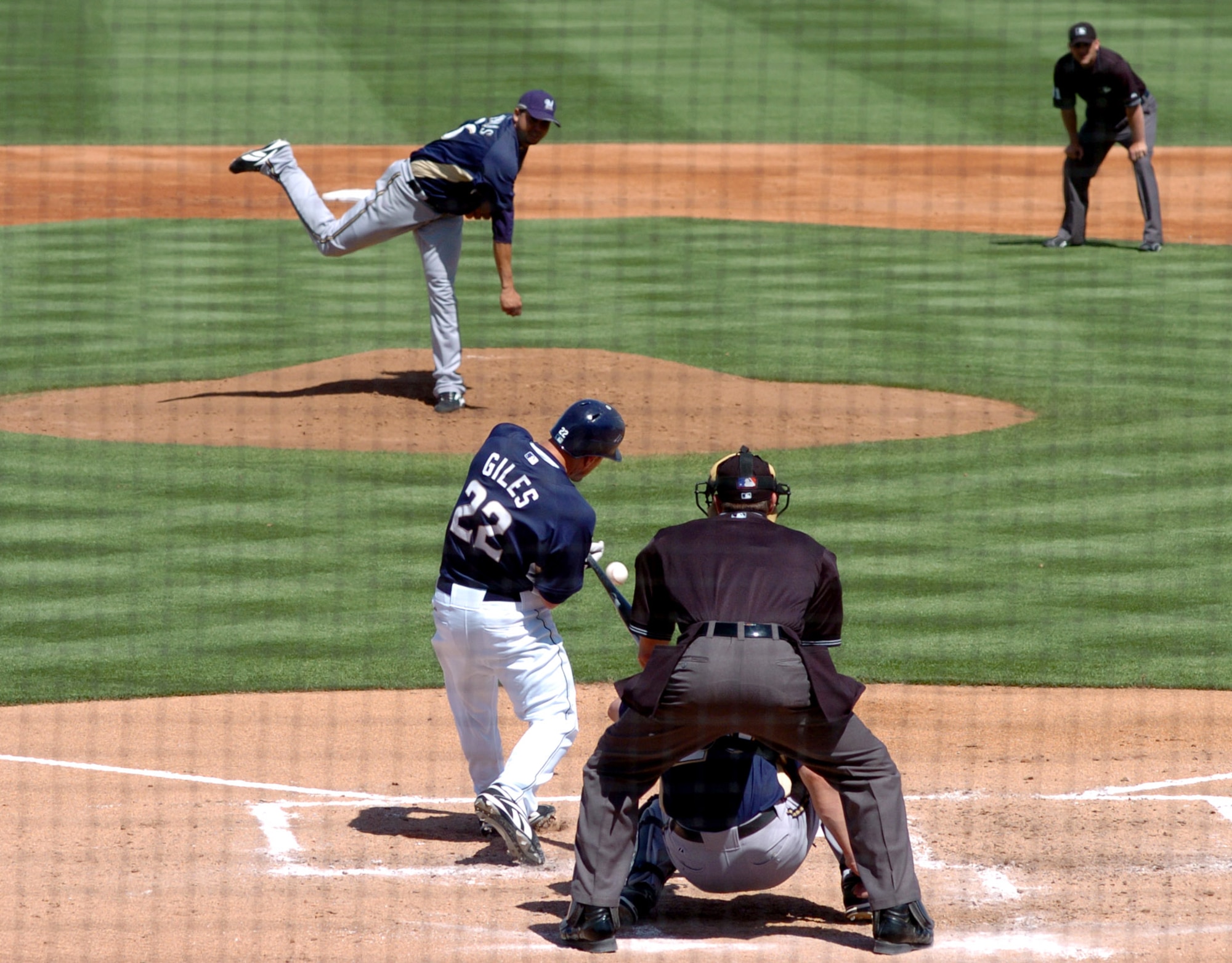 The city of Peoria, Ariz., and the Peoria Sports Complex played host to Air Force Week during a 2007 spring training baseball game between the San Diego Padres and the Milwaukee Brewers March 21. Airmen were invited to attend and the Luke Air Force Base Honor Guard posted the colors. The Wings of Blue parachute demonstration team jumped in the game ball. Staff Sgt. Elizabeth Spradley and Chief Master Sgt. of the Air Force Rodney J. McKinley threw out the first pitches. (U.S. Air Force photo/Staff Sgt. Brian Ferguson)