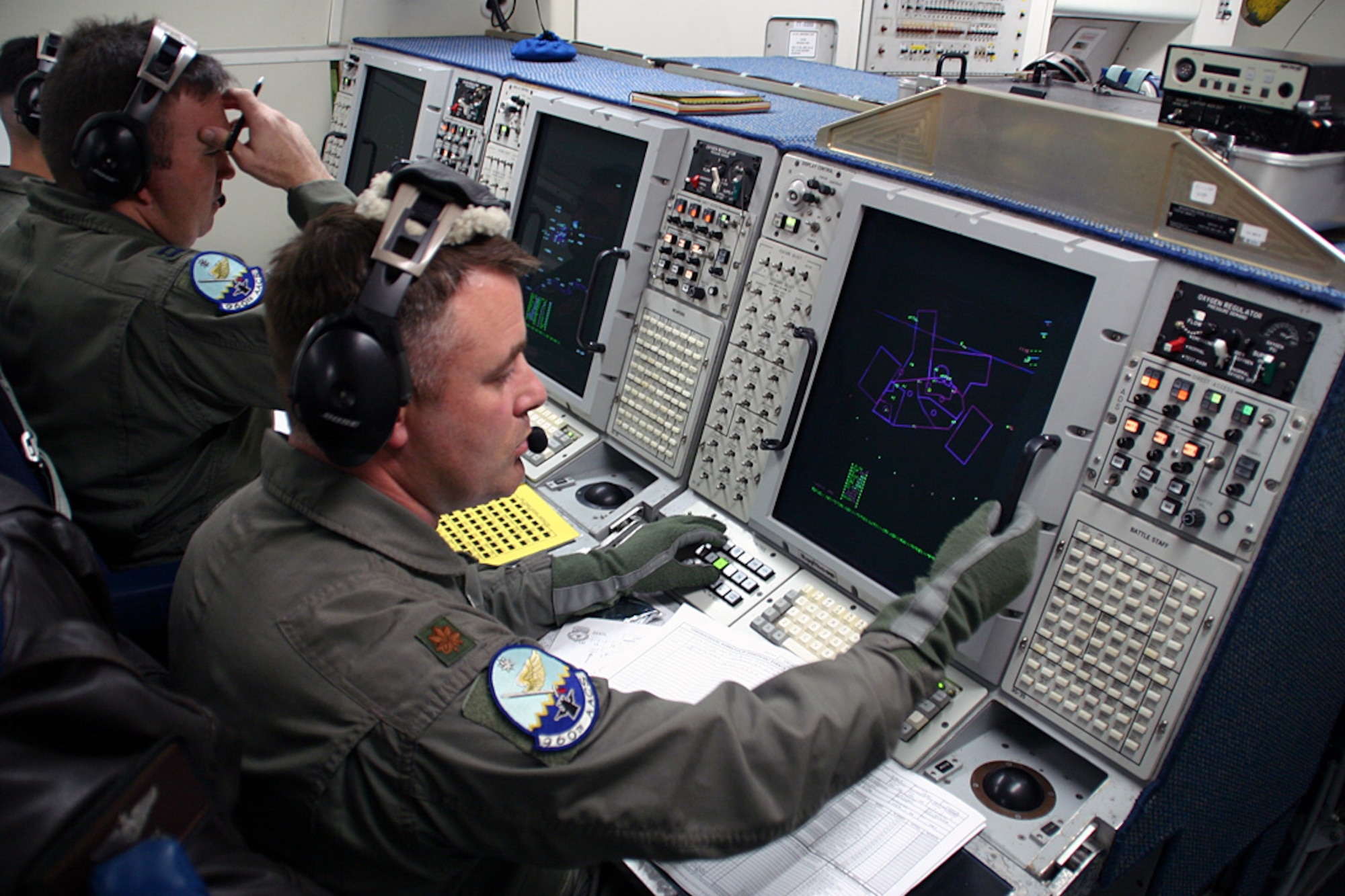 (TINKER AIR FORCE BASE, OKLA) Airmen from the 960th Airborne Air Control Squadron monitor the skies during the E-3 Sentry 30th anniversary flight Mar. 23.  The E-3 first arrived at Tinker on Mar. 23, 1977, and Airmen have been conducting the same aerial surviellance mission for the past 30 years. (Air Force photo by Staff Sgt. Stacy Fowler) 