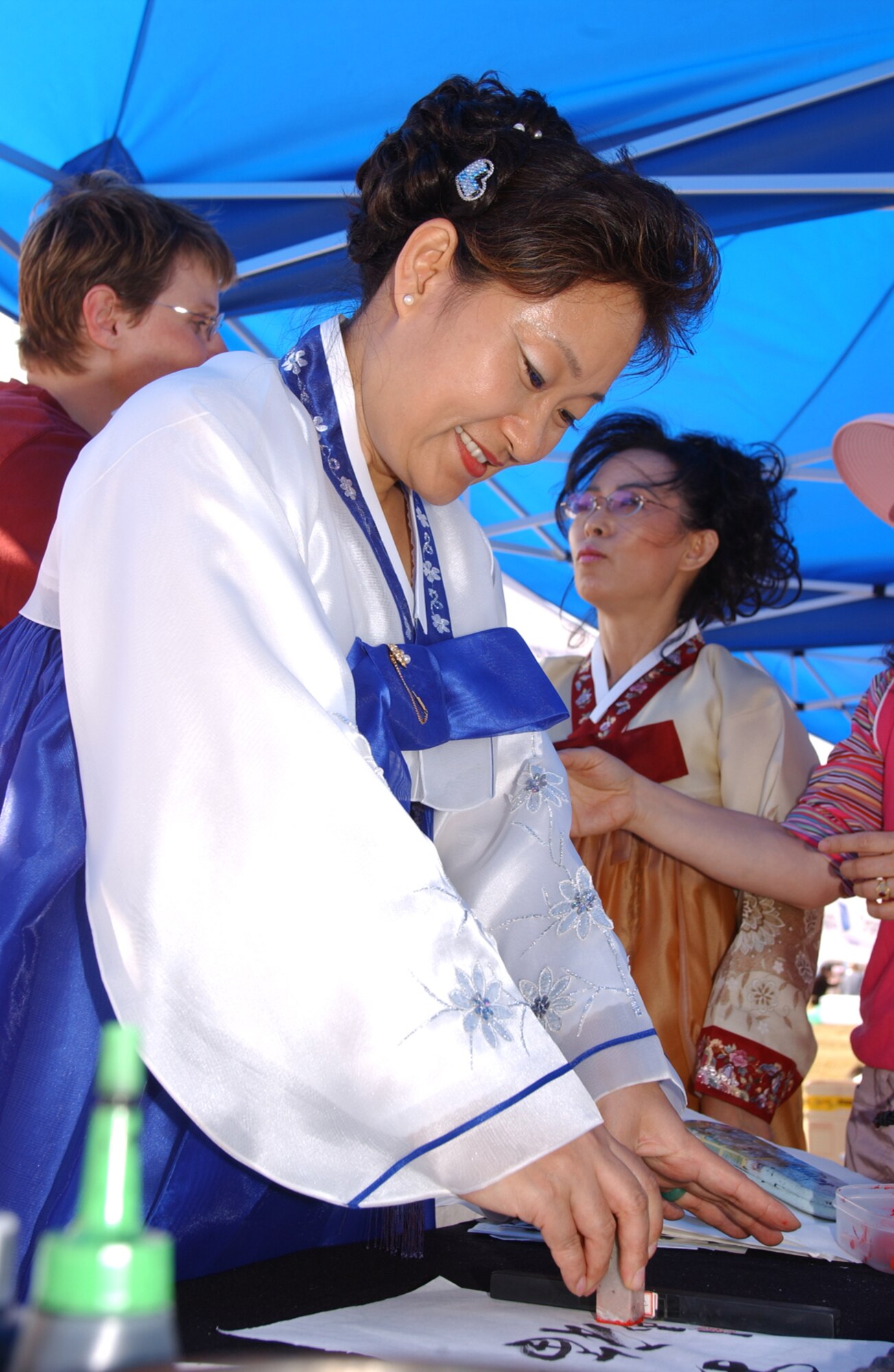 OSAN AIR BASE, Republic of Korea --  One of several traditional activities shown by Koreans during Osan’s 2006 Air Power Day was Calligraphy. They also performed several traditional dances and games, and provided a food tasting. (U.S. Air Force photo by Airman Jason Epley)