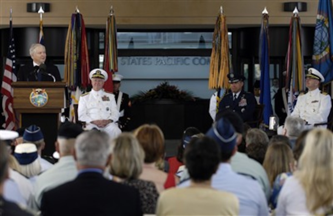 Defense Secretary Robert M. Gates addresses the audience during the U.S. Pacific Command change of command ceremony at Camp Smith, Hawaii, March 26, 2007. U.S. Navy Adm. Timothy J. Keating, second from left, took over command of PACOM from U.S. Air Force Lt. Gen. Daniel Leaf, second from right. 