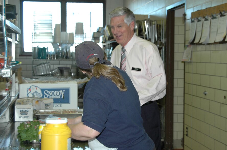 Garry Shaffer, Dakota's manager, speaks with Ms. Jean West, Dakota's cook, as she prepares lunch.
Mr. Shaffer is the club's new manager and looks forward to revamping the club.