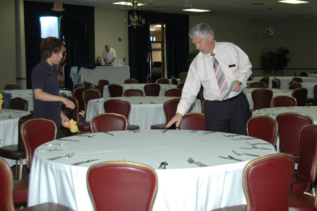 Garry Shaffer, Dakota's manager, helps Ms. Amber Green, Dakota's waitress, set tables prior to a banquet the club hosted.
Mr. Shaffer is the club's new manager and looks forward to revamping the club.