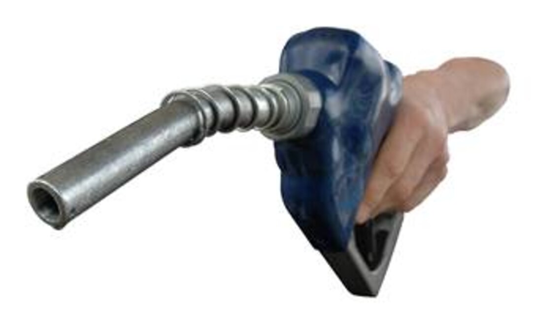 A hand holding a fuel pump handle. (Photo by Staff Sgt. Matthew Hannen)