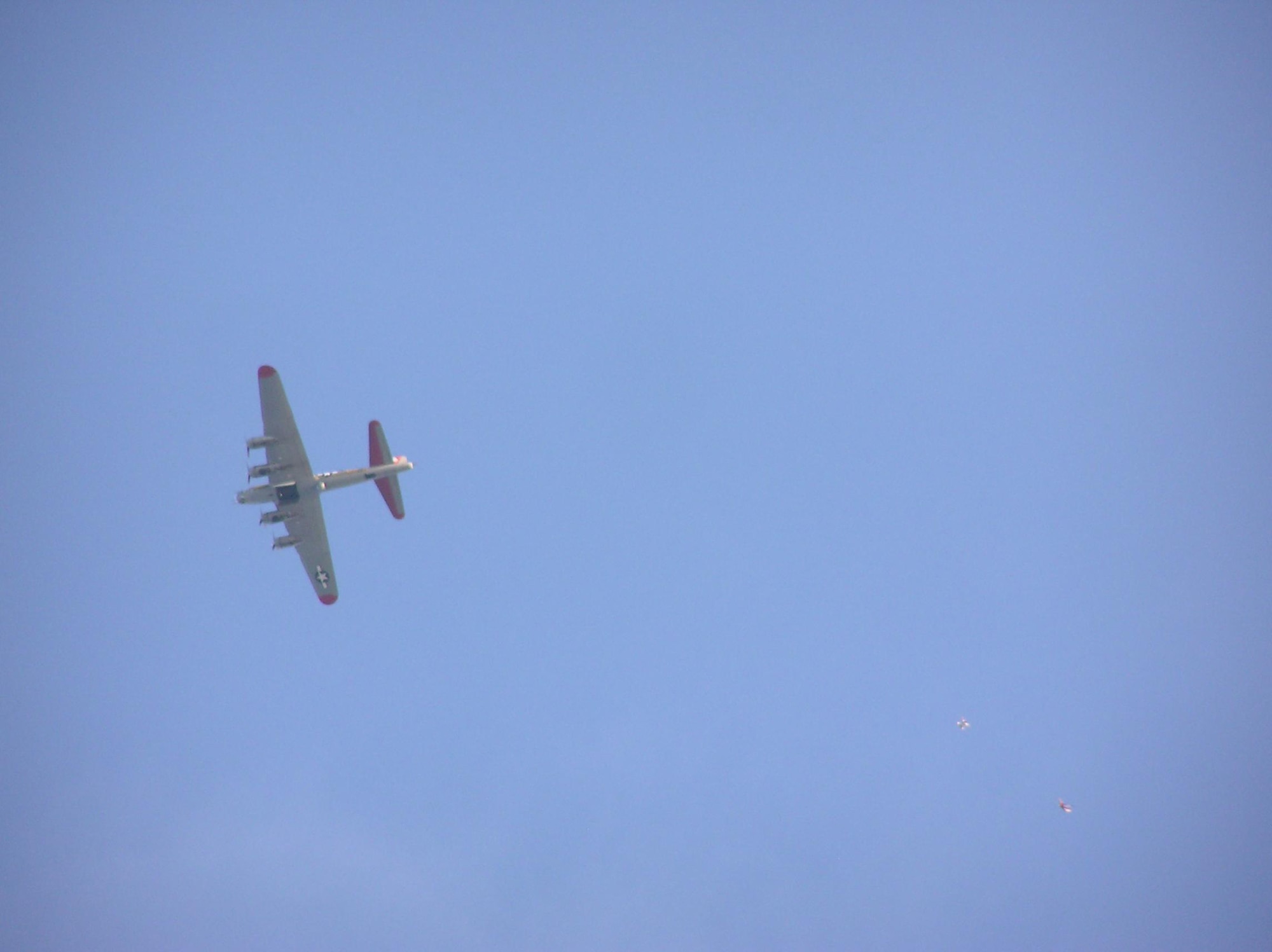 DESTIN, Fla. -- First Lt. Dan Montes and his skydiving partner Dan Flynn free fall in the moments after leaping from the bomb bay of the "Nine-O-Nine," a restored B-17 Flying Fortress. The aircraft is named by the Collings Foundation in honor of a 91st Bomb Group, 323rd Squadron plane of the same name which completed 140 missions without an abort or loss of a crewman. Both men work for the Air Force Research Laboratory at Eglin Air Force Base, Fla. (Courtesy photo)