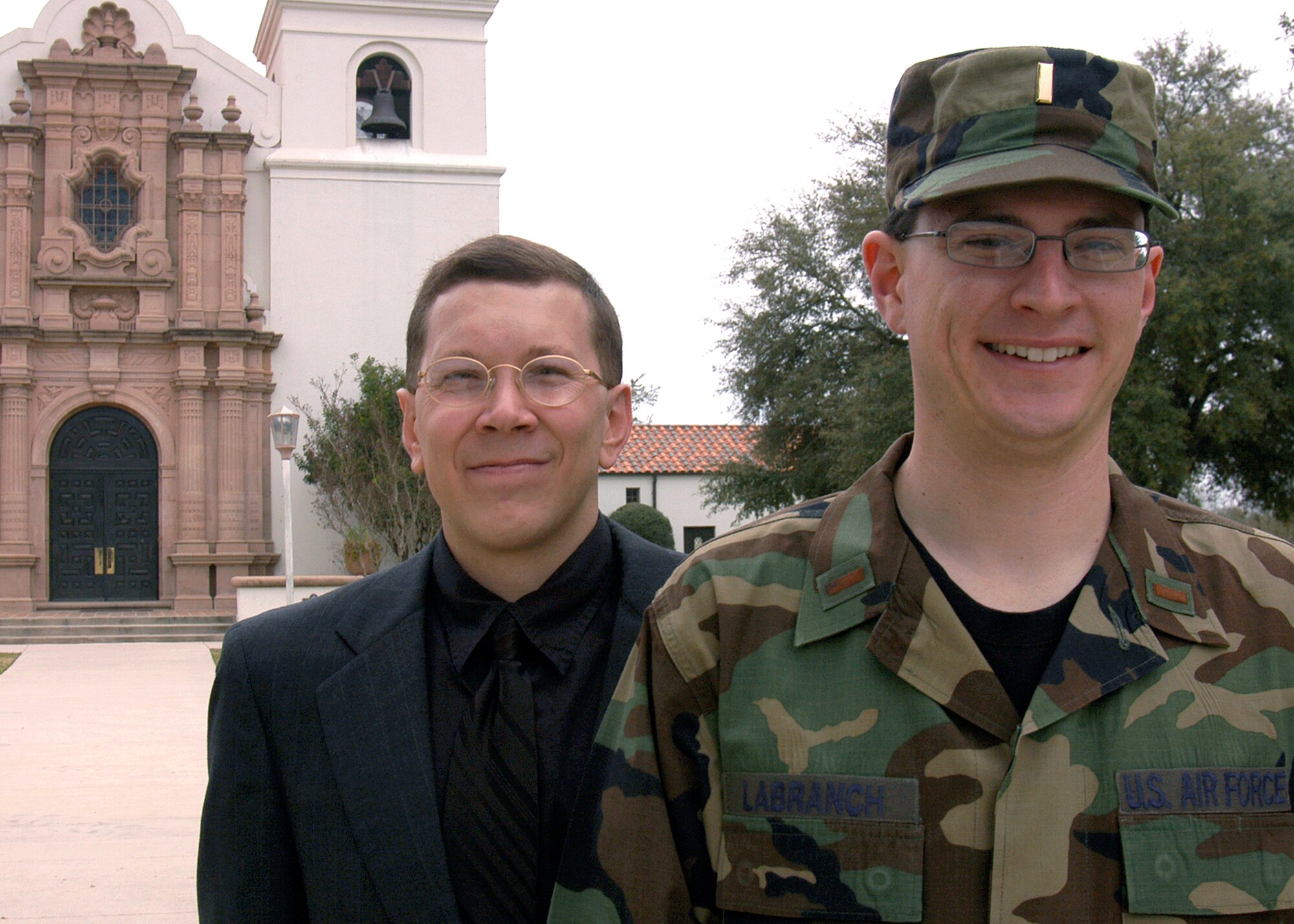 Air Force 2nd Lts. Brian Wood, left, and Derek LaBranch, stand outside the chapel on Randolph Air Force Base, Texas. Both lieutenants study theology at Assumption Seminary in San Antonio under the Air Force Chaplain Candidate program. Upon their graduation, with their diocese' endorsement, the lieutenants are eligible for reappointment as chaplains. (U.S. Air Force photo/Staff Sgt. Jennifer Lindsey)