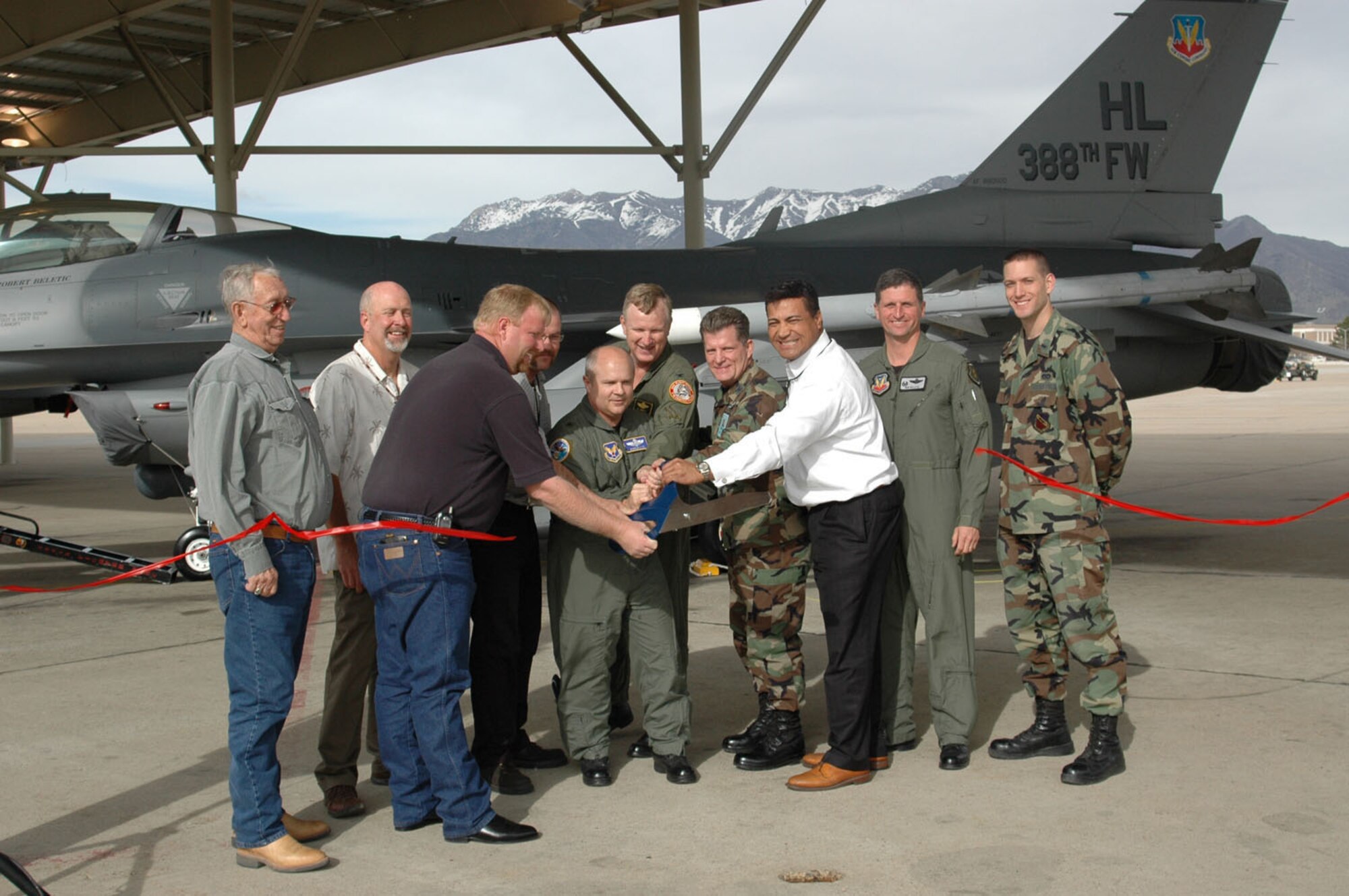 From left to right: Mr. Jerry and Tim Huffman, Richard Pra, Kevin Morgan, Brig. Gen. Charlie Lyon, Col. Al Hawley, 419th FW vice commander, Col. Scott Chambers, 75th Air Base Wing commander, Col. Robert Beletic, 388th FW commander and first Lt. Ryan LeBlanc. (U.S. Air Force photo by Airman 1st Class Stefanie Torres)