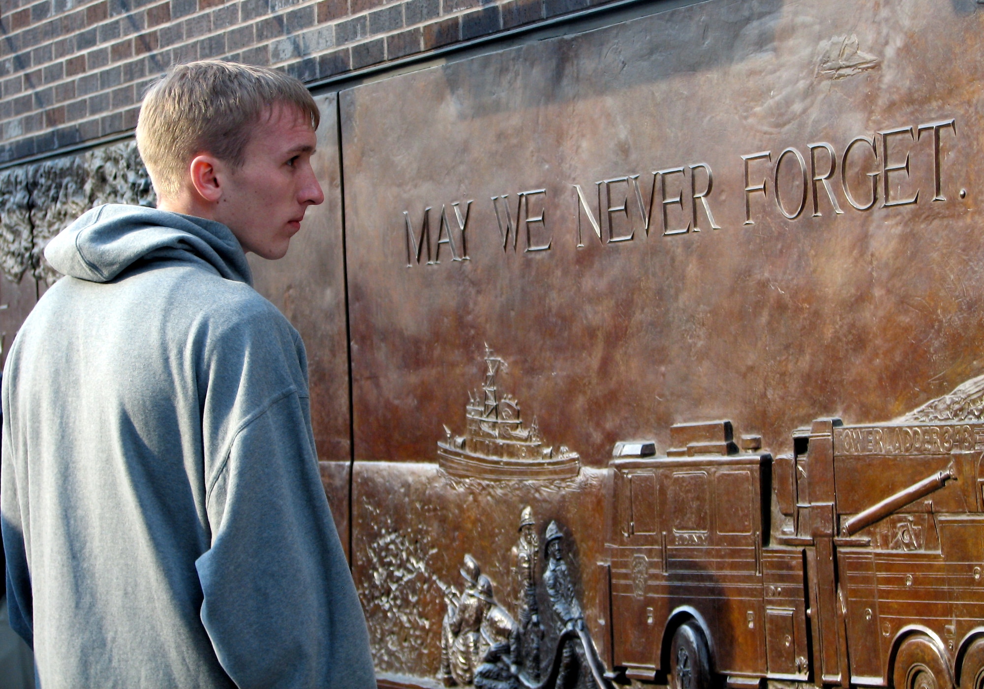Cadet 1st Class Ryan Teets views the Ladder 10 Memorial at Ground Zero March 25 in New York City. The team is playing in the National Invitation Tournament semifinals March 27 against the Clemson Tigers in Madison Square Garden. (U.S. Air Force photo/Staff Sgt. Steve Grever) 