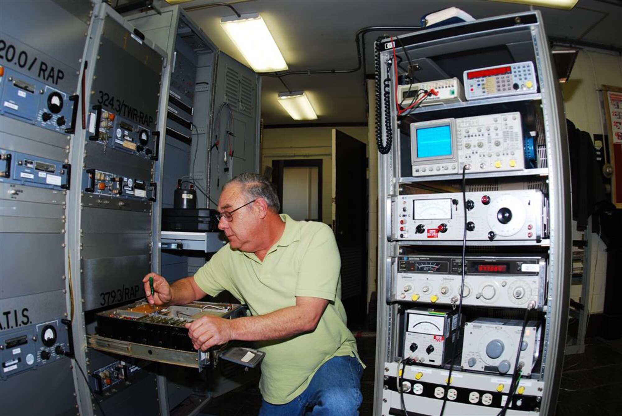 GRISSOM AIR RESERVE BASE, Ind., -- Mike Harford, a 434th Communication Squadron air traffic control and landing systems technician, adjusts the modulation on an UHF transmitter. The transmitter is used by the radar approach control facility for communication with aircraft with in the control area of Grissom. Mr. Harford has 45 years experience in the radio communication career field. (U.S. Air Force photo/Master Sgt. Steve Robertson)
