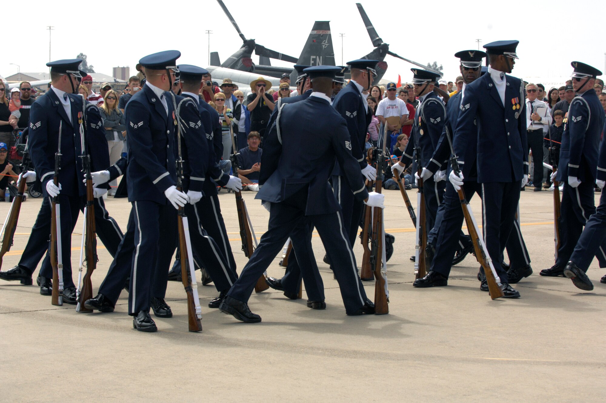 The United States Air Force Honor Guard Drill Team performs March 24 during the Luke Air Force Base, Ariz., air show. The drill team is the traveling component of the Air Force Honor Guard and tours Air Force bases worldwide showcasing the precision of today's Air Force to recruit, retain and inspire Airmen for the Air Force mission. (U.S. Air Force photo/Airman 1st Class Rusti Caraker) 