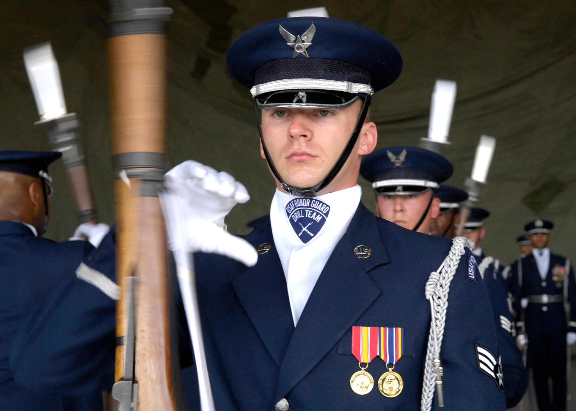 Senior Airman Timothy Treadway, of the United States Air Force Honor Guard Drill Team, performs March 24 during the air show at Luke Air Force Base, Ariz. The drill team is the traveling component of the Air Force Honor Guard and tours Air Force bases worldwide showcasing the precision of today's Air Force to recruit, retain and inspire Airmen for the Air Force mission. (U.S. Air Force photo/Airman 1st Class Rusti Caraker) 