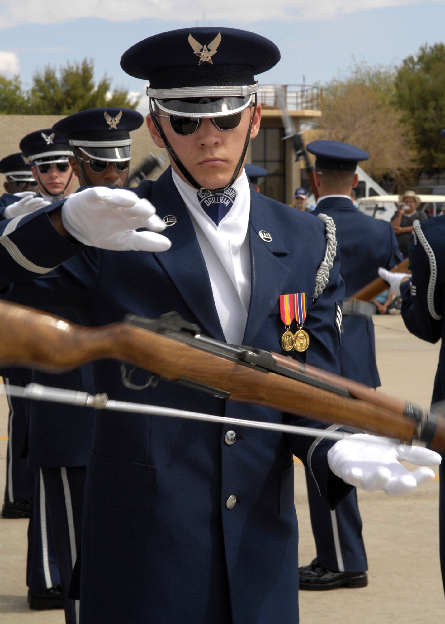 Senior Airman Jason Martin, of the United States Air Force Honor Guard Drill Team, performs March 24 during the air show at Luke Air Force Base, Ariz. The drill team is the traveling component of the Air Force Honor Guard and tours Air Force bases worldwide showcasing the precision of today's Air Force to recruit, retain and inspire Airmen for the Air Force mission. (U.S. Air Force photo/Airman 1st Class Rusti Caraker) 